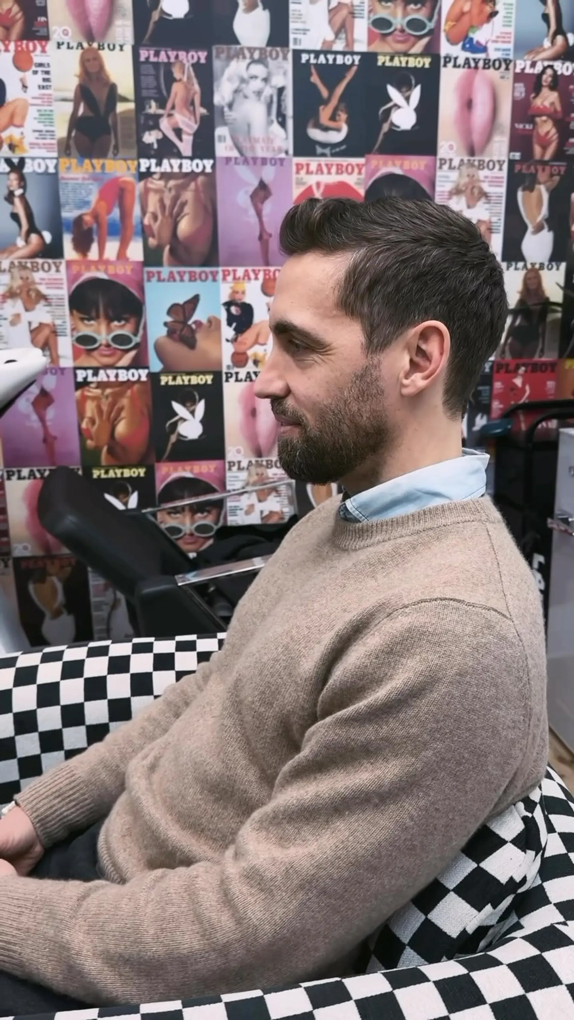 A classic short men's scissor haircut with softly tapered sides and a natural, textured top. 1