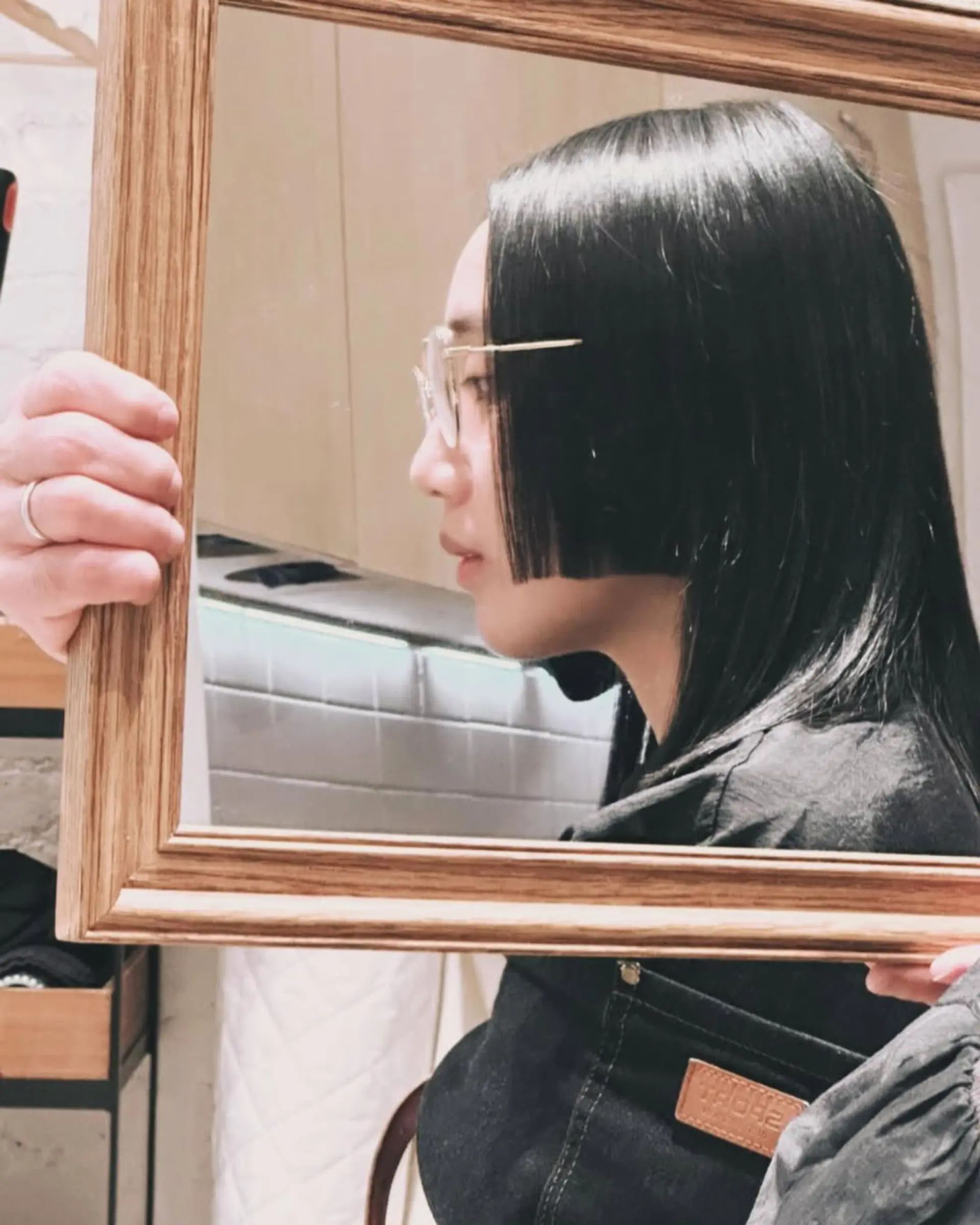 A blunt, chin-length bob with a sharp, clean line. 1