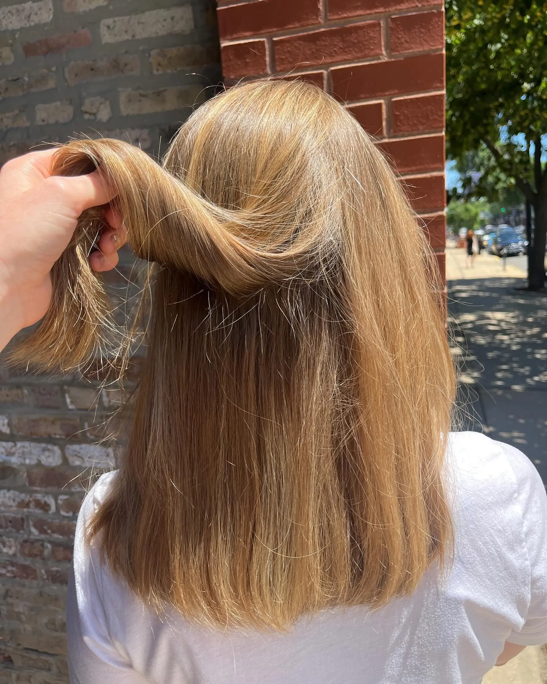 A classic straight cut with blunt bangs and layered ends. 2