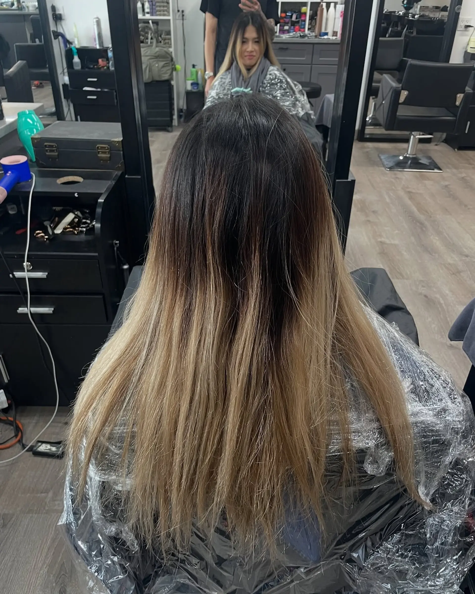 Long, layered blonde hair styled into relaxed beachy waves. 3