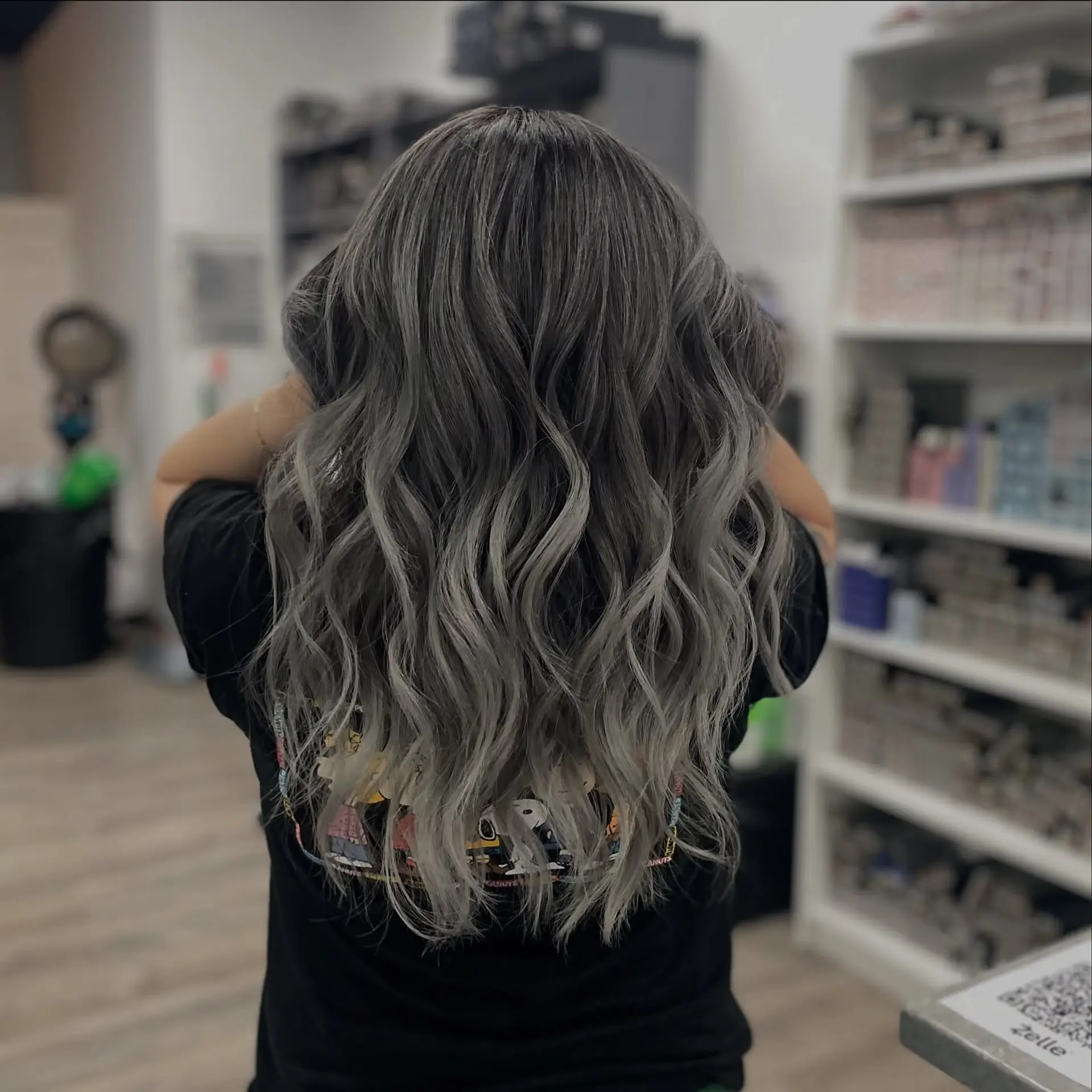 Long wavy hair with a silver fox color melt effect. 1