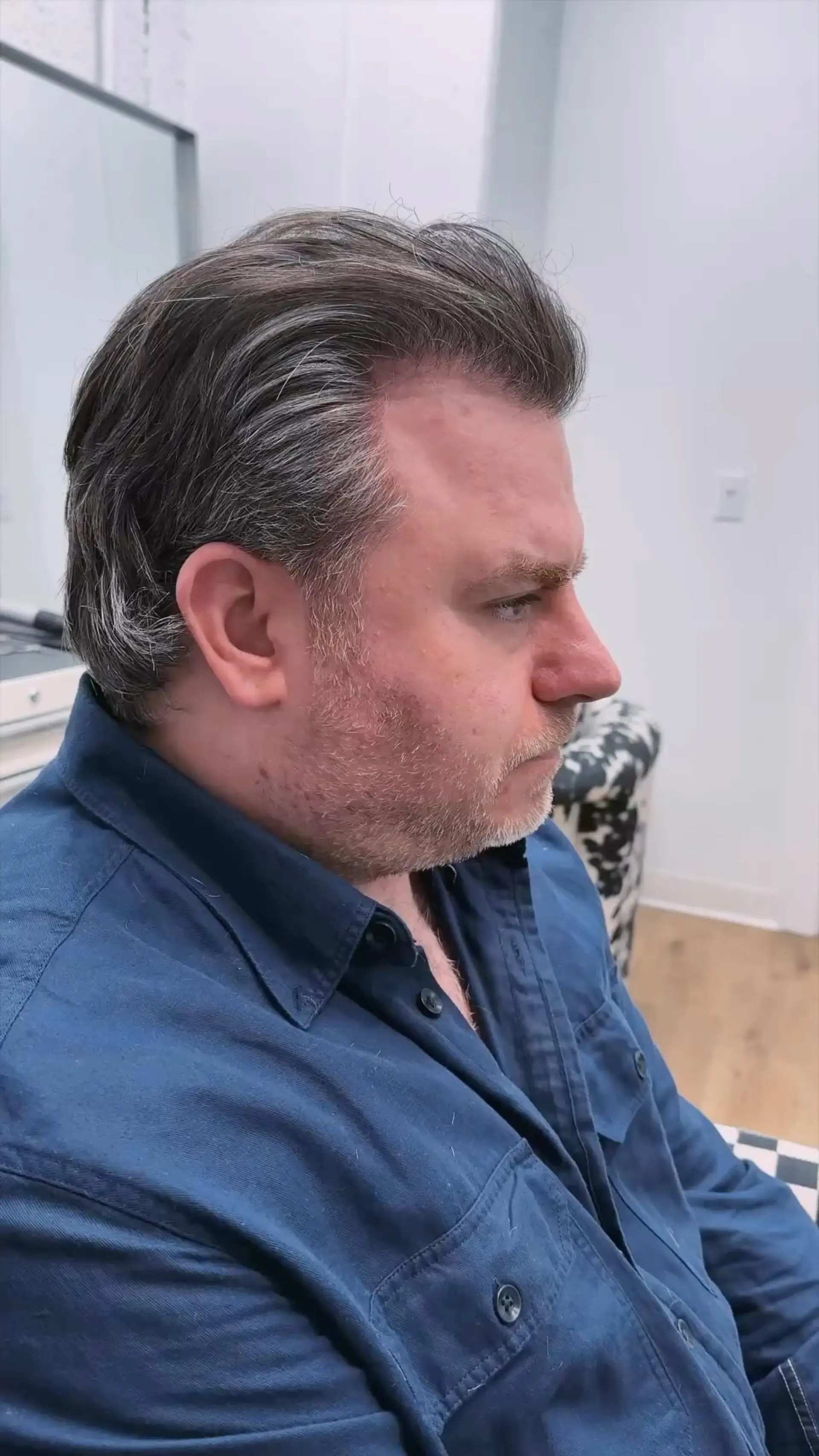 A textured soft modern mullet swept back away from the face, tapering naturally at the sides with soft length extending down the nape. 1