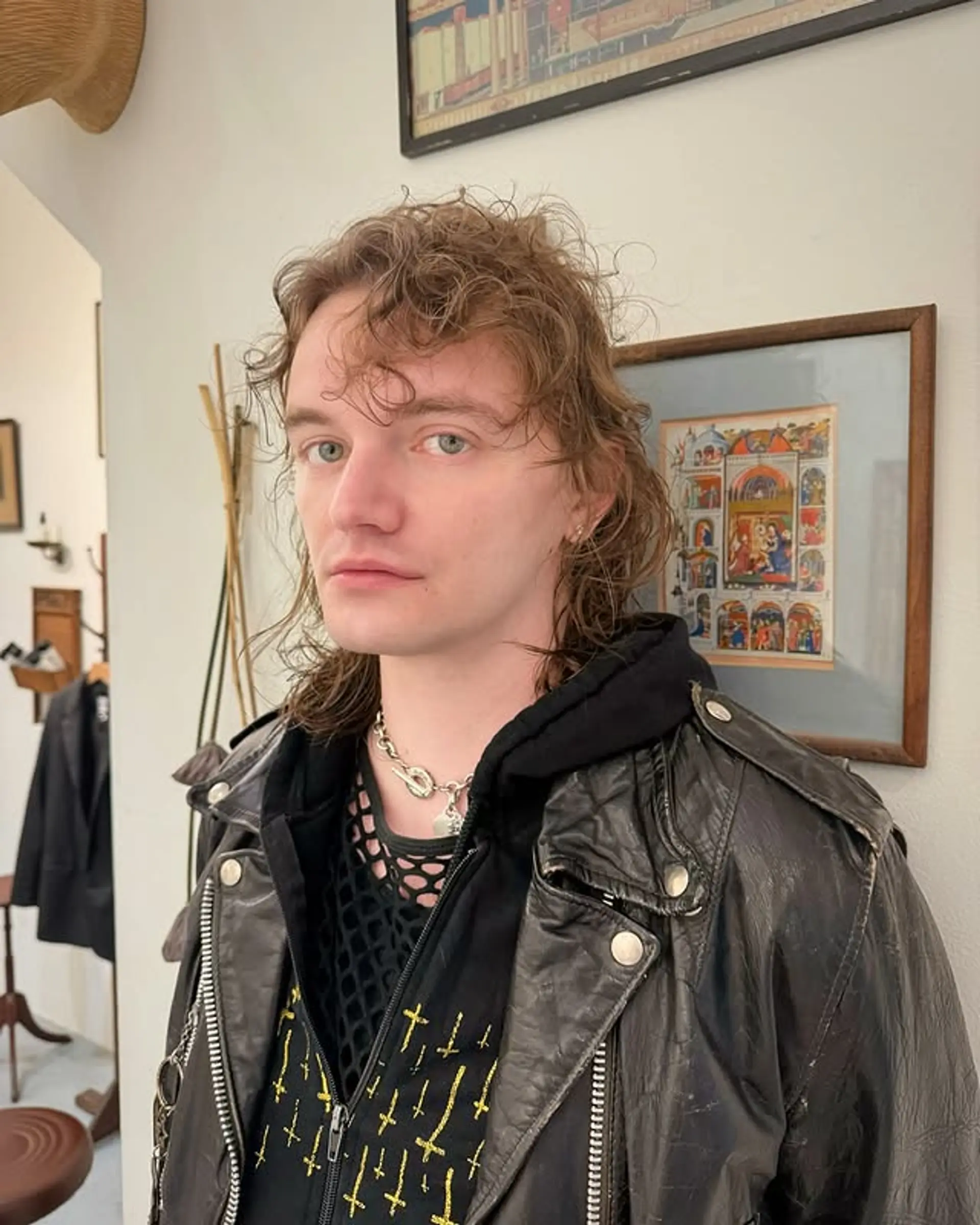 A contemporary shag mullet with textured layers and tapered sides, perfect for a stylish and edgy look. 1