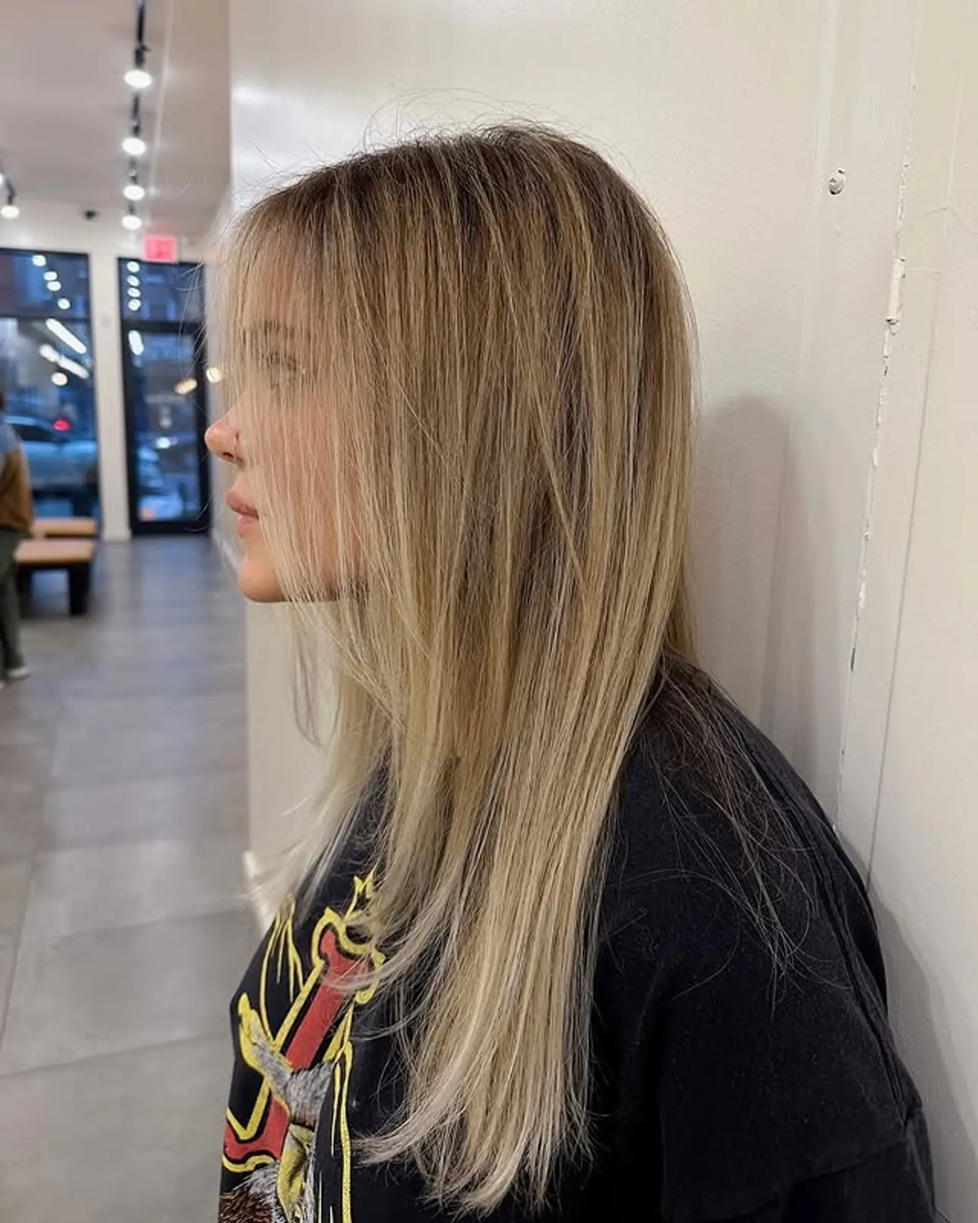 Long layered hairstyle with curtain bangs. 1