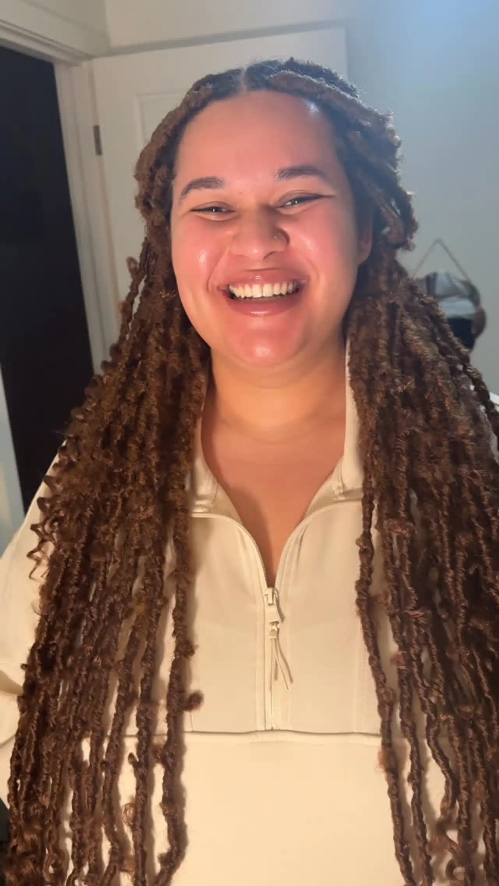 Extra long warm caramel brown distressed butterfly faux locs with center parting. 1