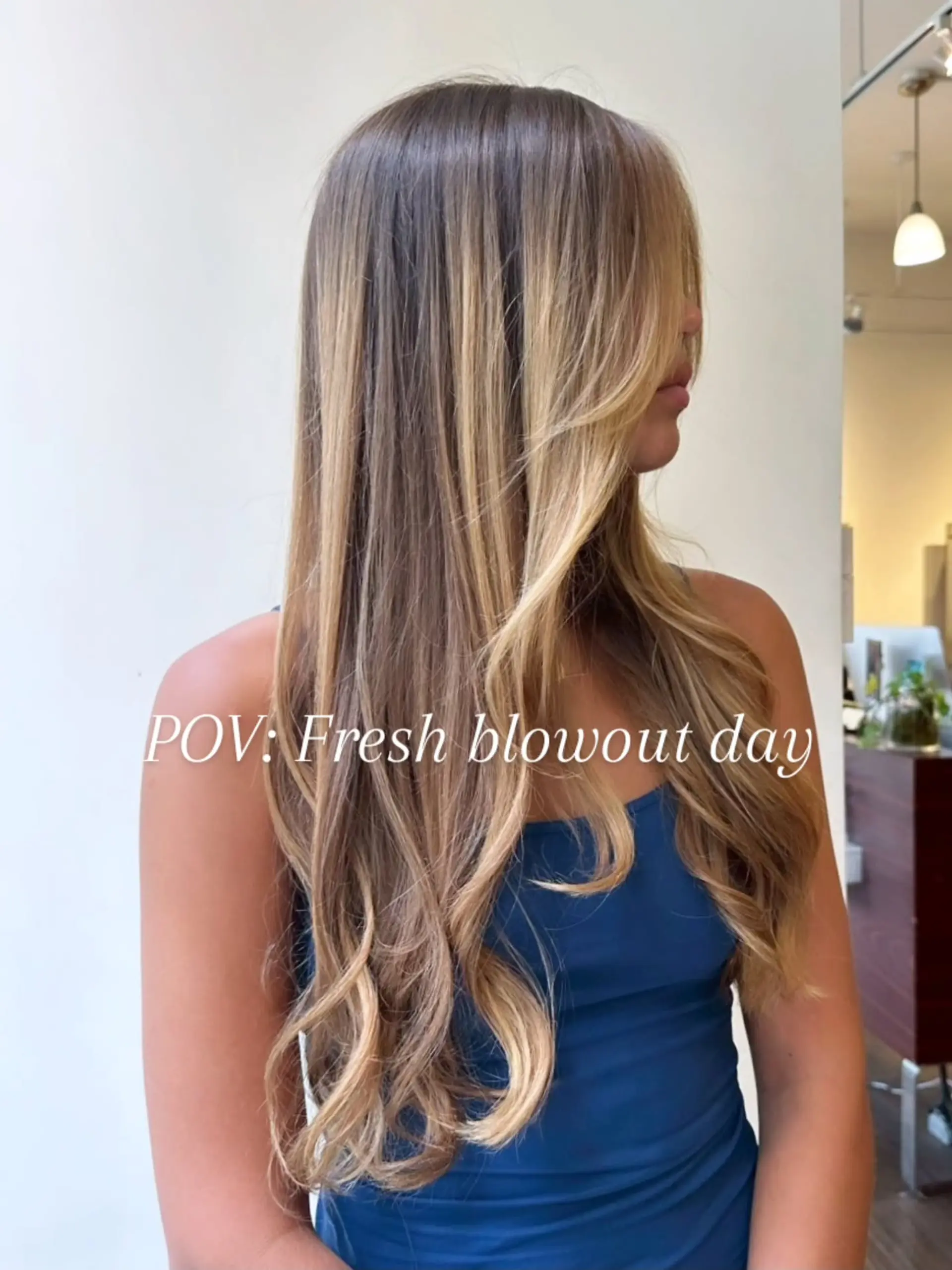 Long hair featuring warm blonde highlights, styled in a sleek blowout with soft waves and layered face-framing pieces. 1