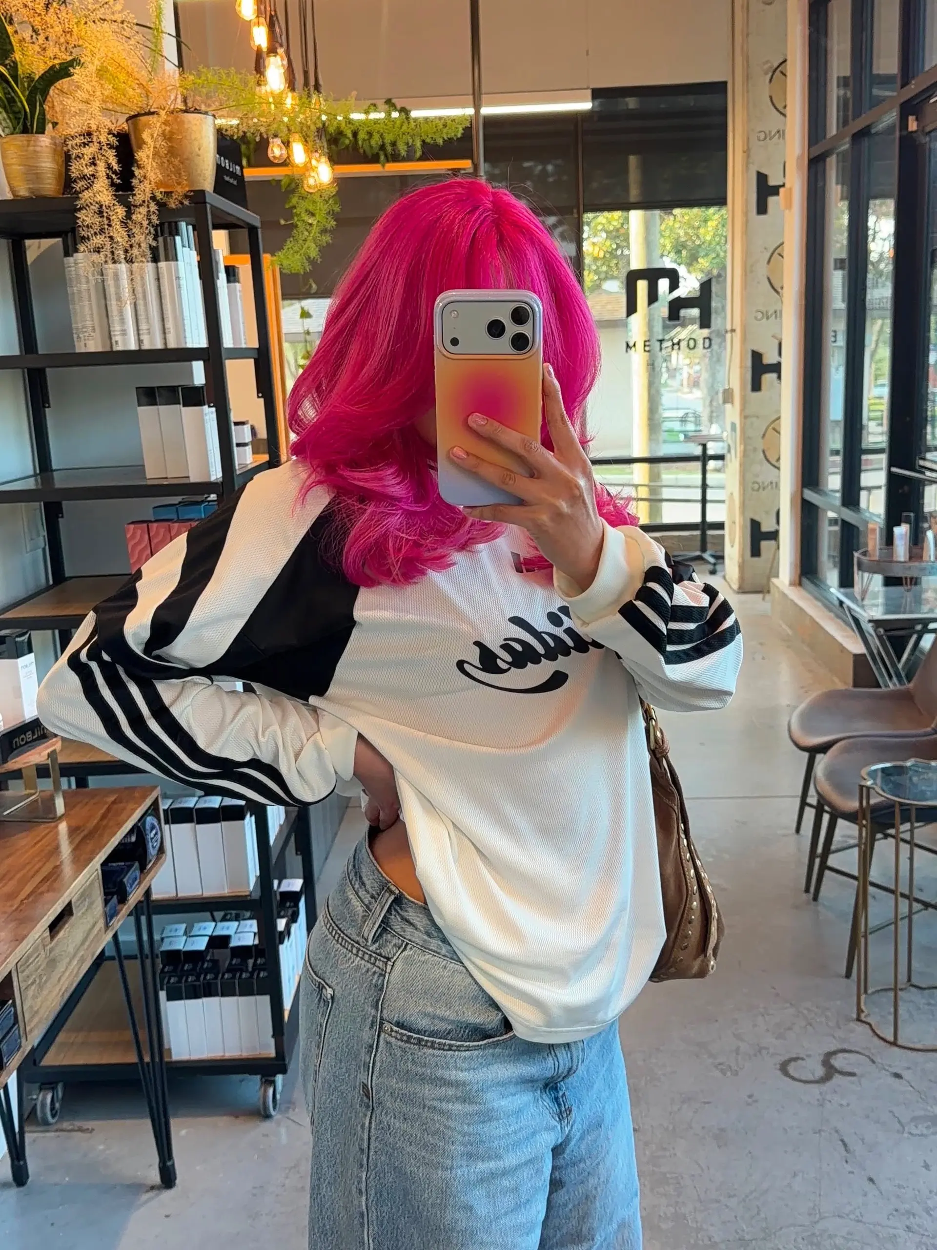 Vibrant hot pink medium-length hair styled with soft, voluminous waves. 1