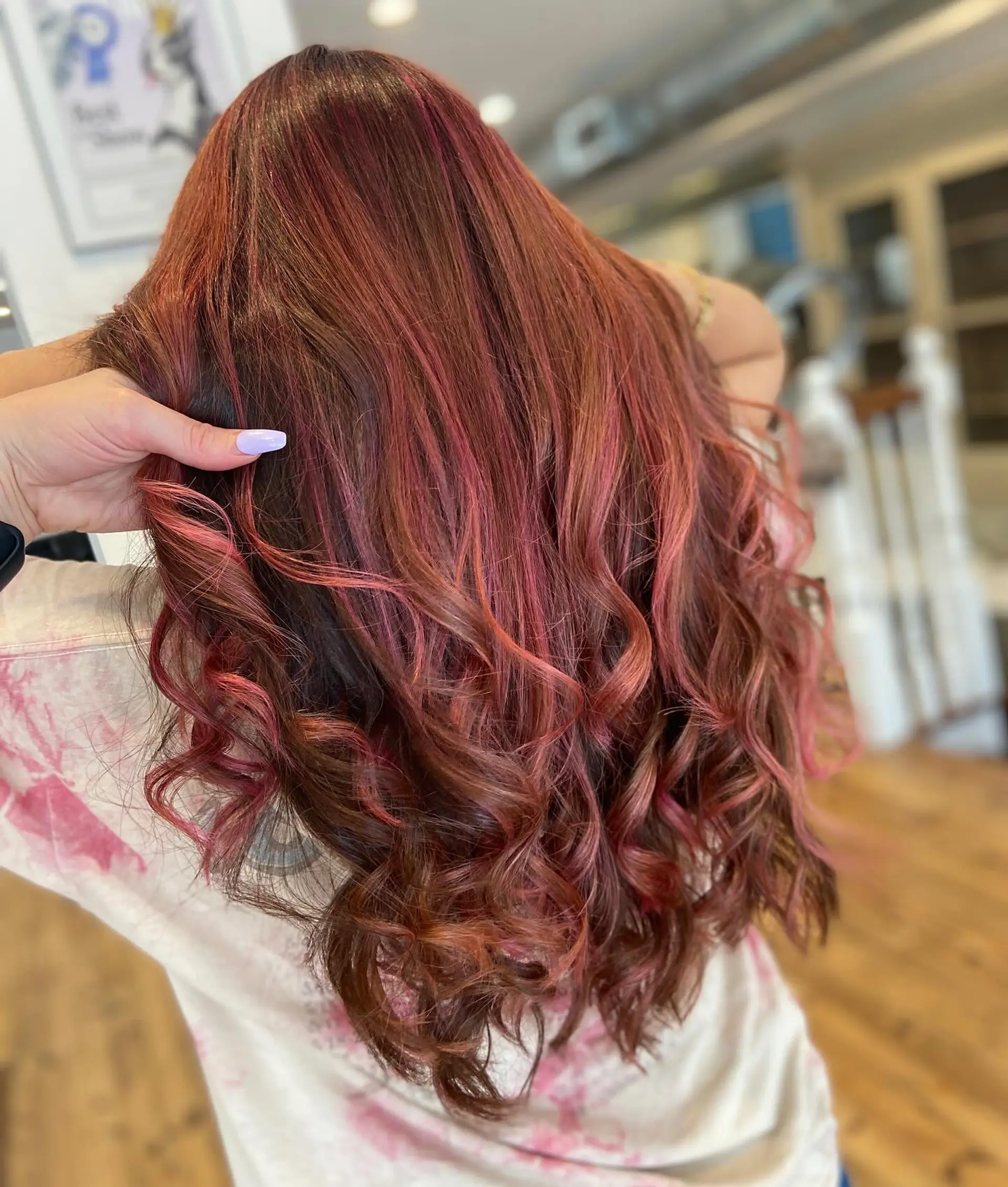 Long copper hair with soft waves and strawberry blonde highlights. 1