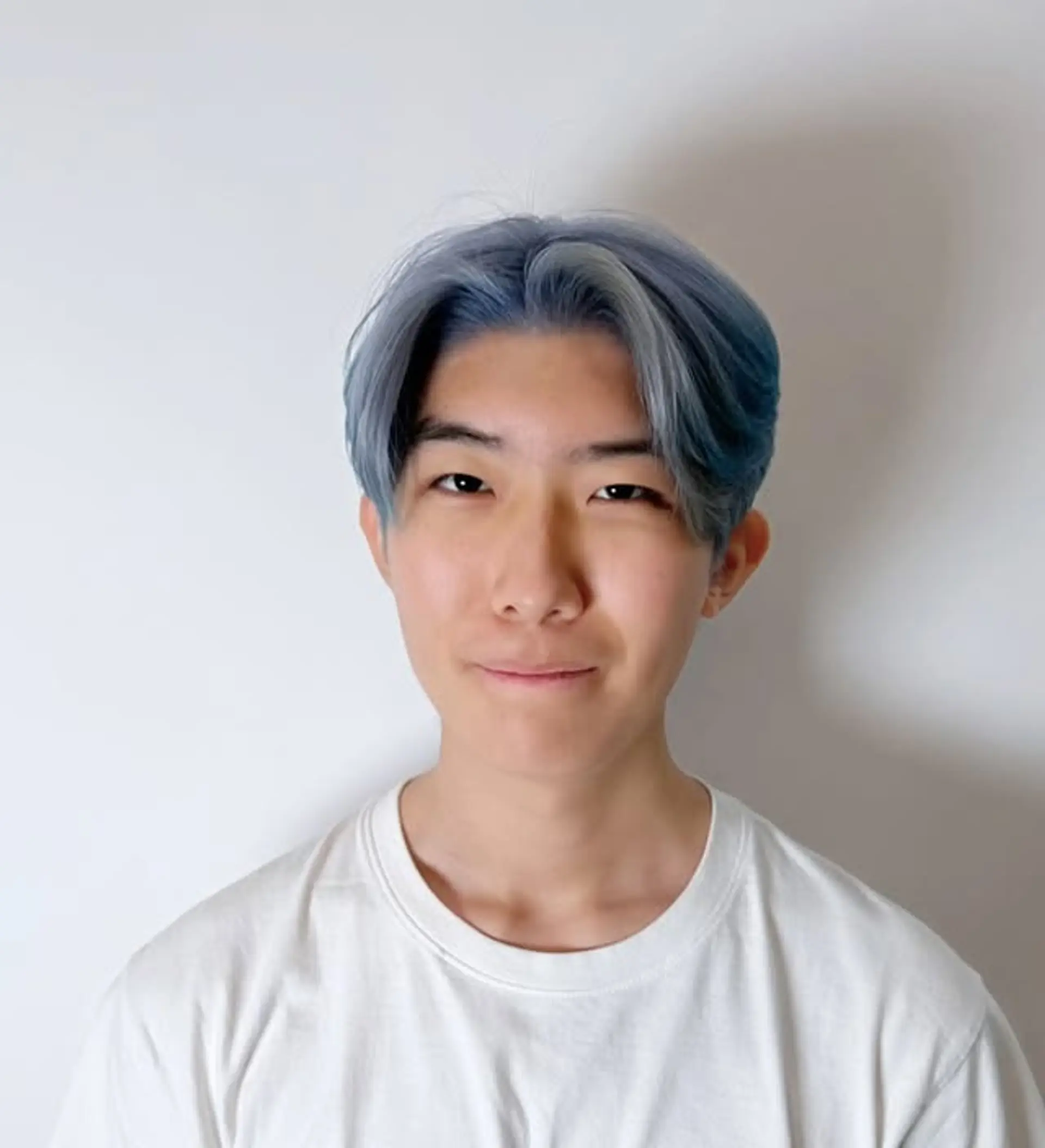 A trendy medium-length hairstyle featuring a modern Korean wave with a striking icy blue color. 1