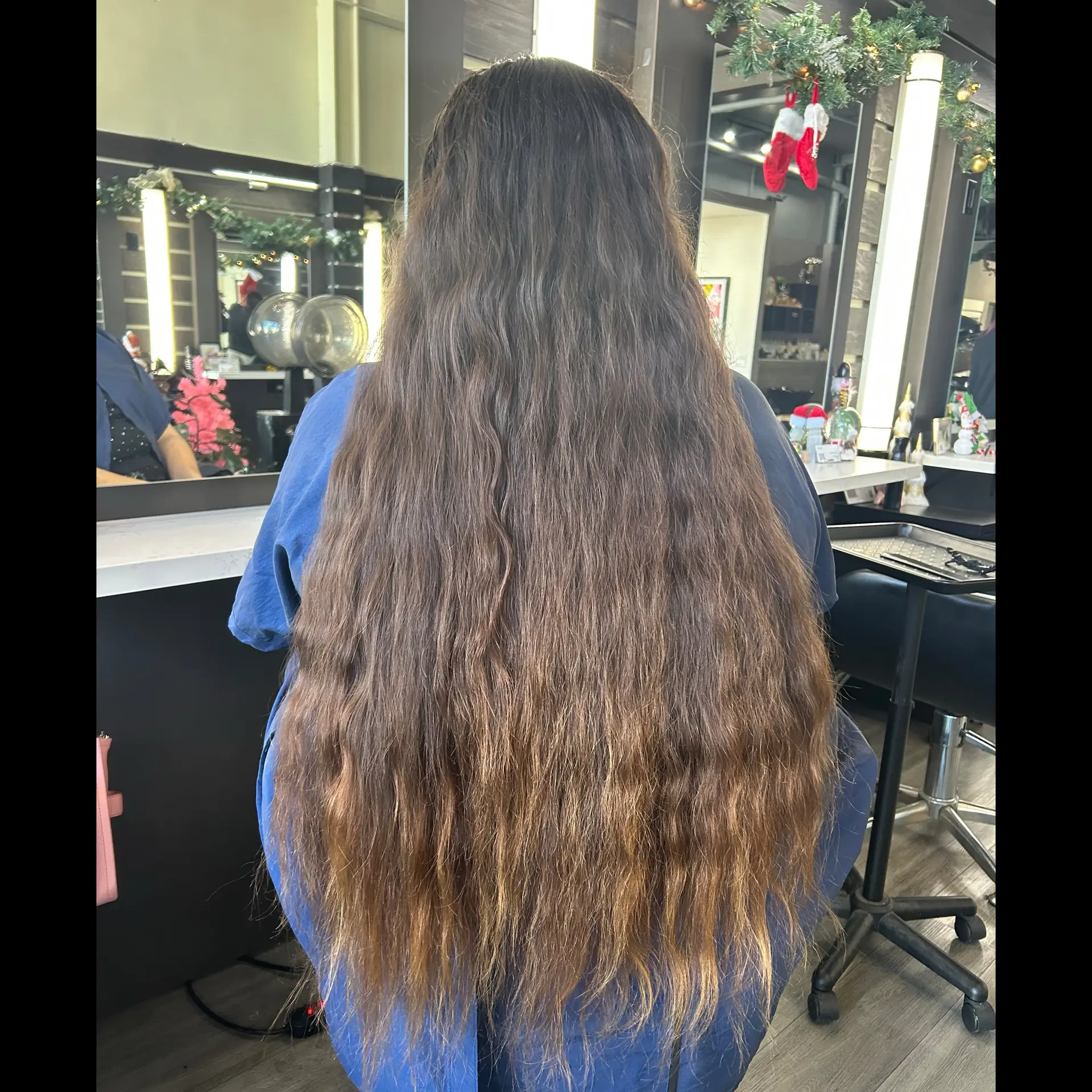 Extra-long brunette hair falling past the waist with natural subtle waves and sun-kissed gradient ends. 1