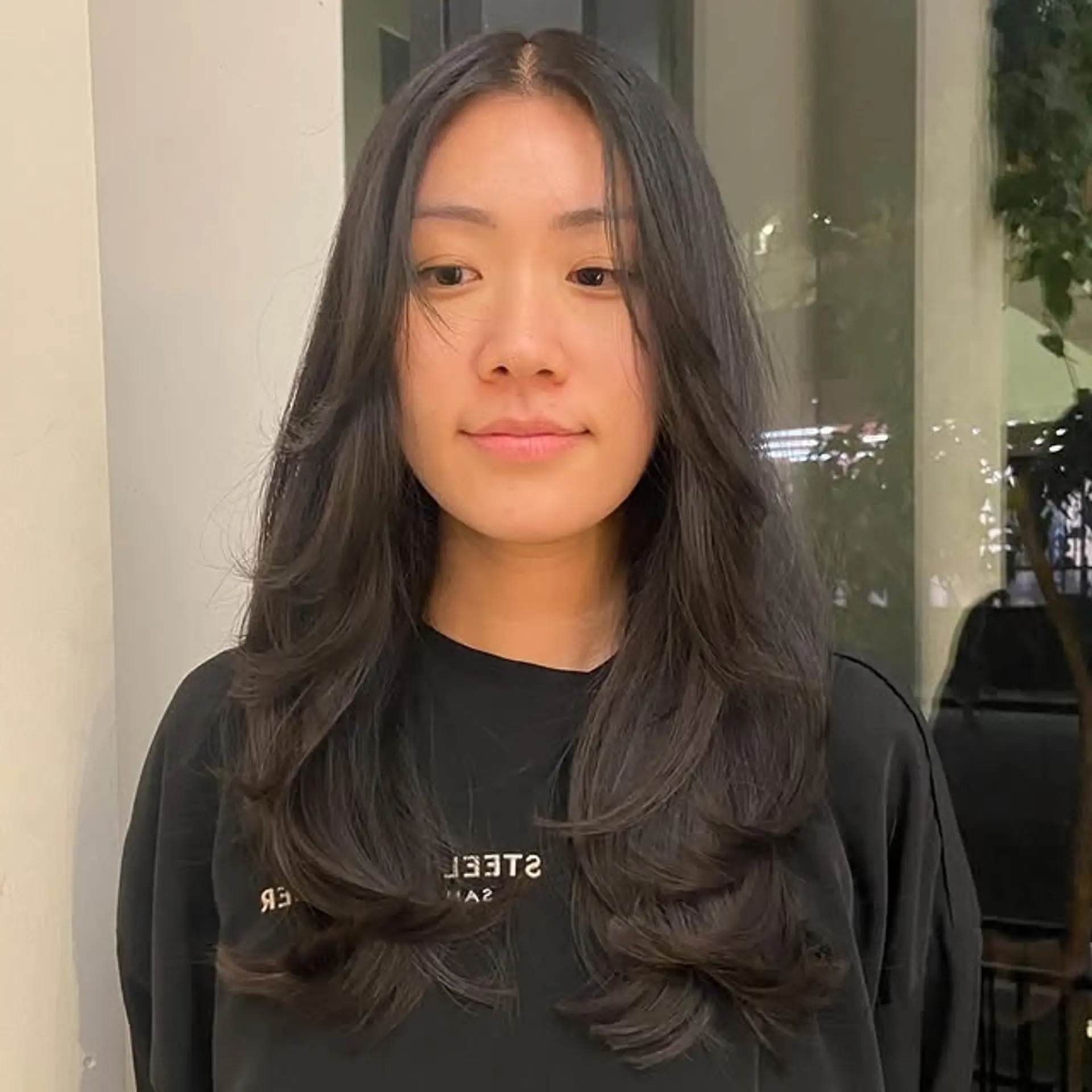 Long layered hair with a blowout style. 1