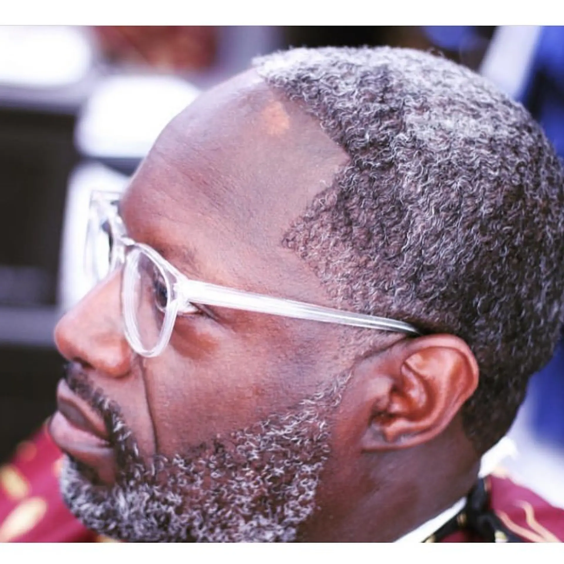A close-cropped Caesar haircut with a crisp edge-up, paired with a neatly sculpted beard. 1