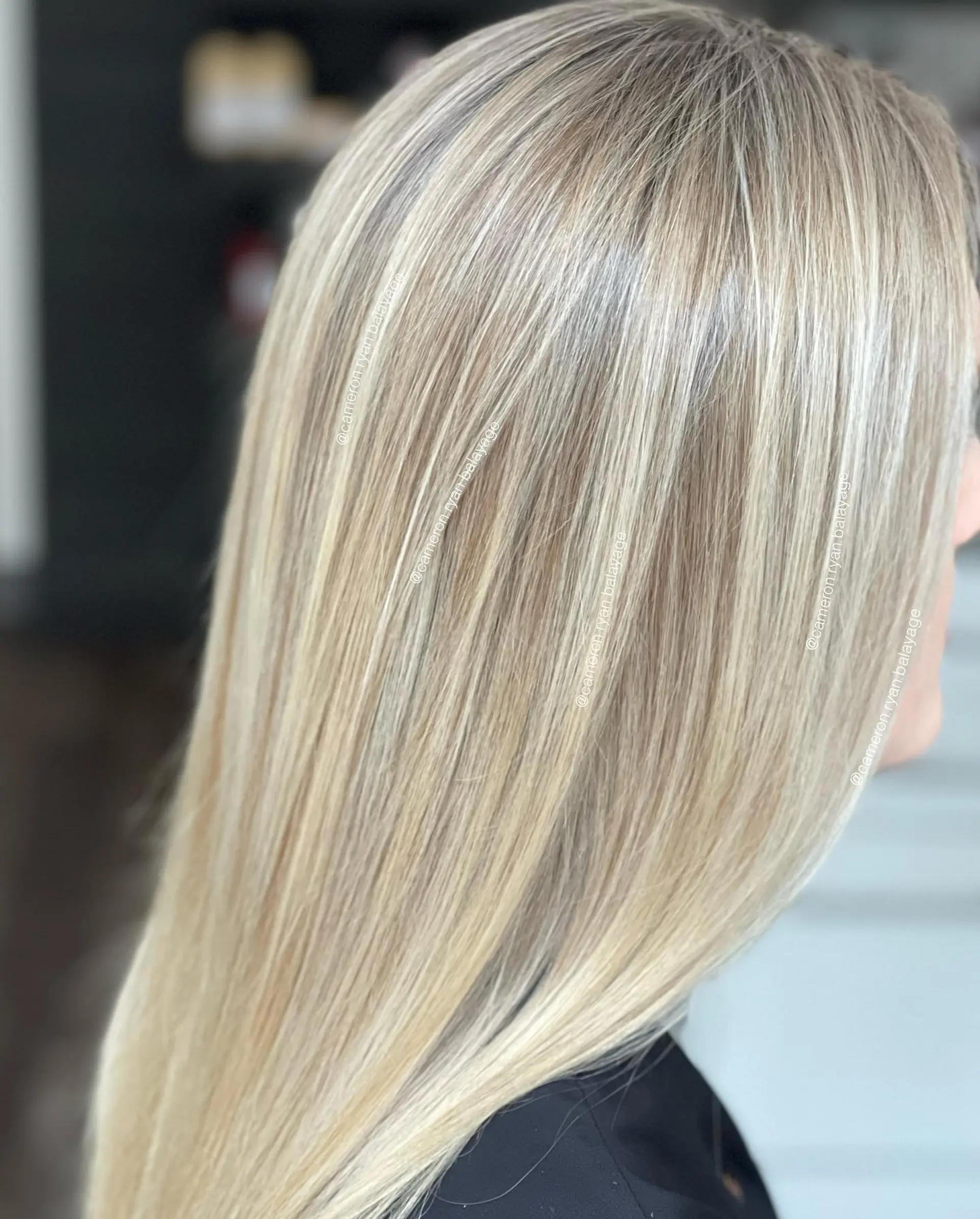 Straight blonde hair styled smooth with seamless, fine-weave foil highlights and a gloss finish. 1