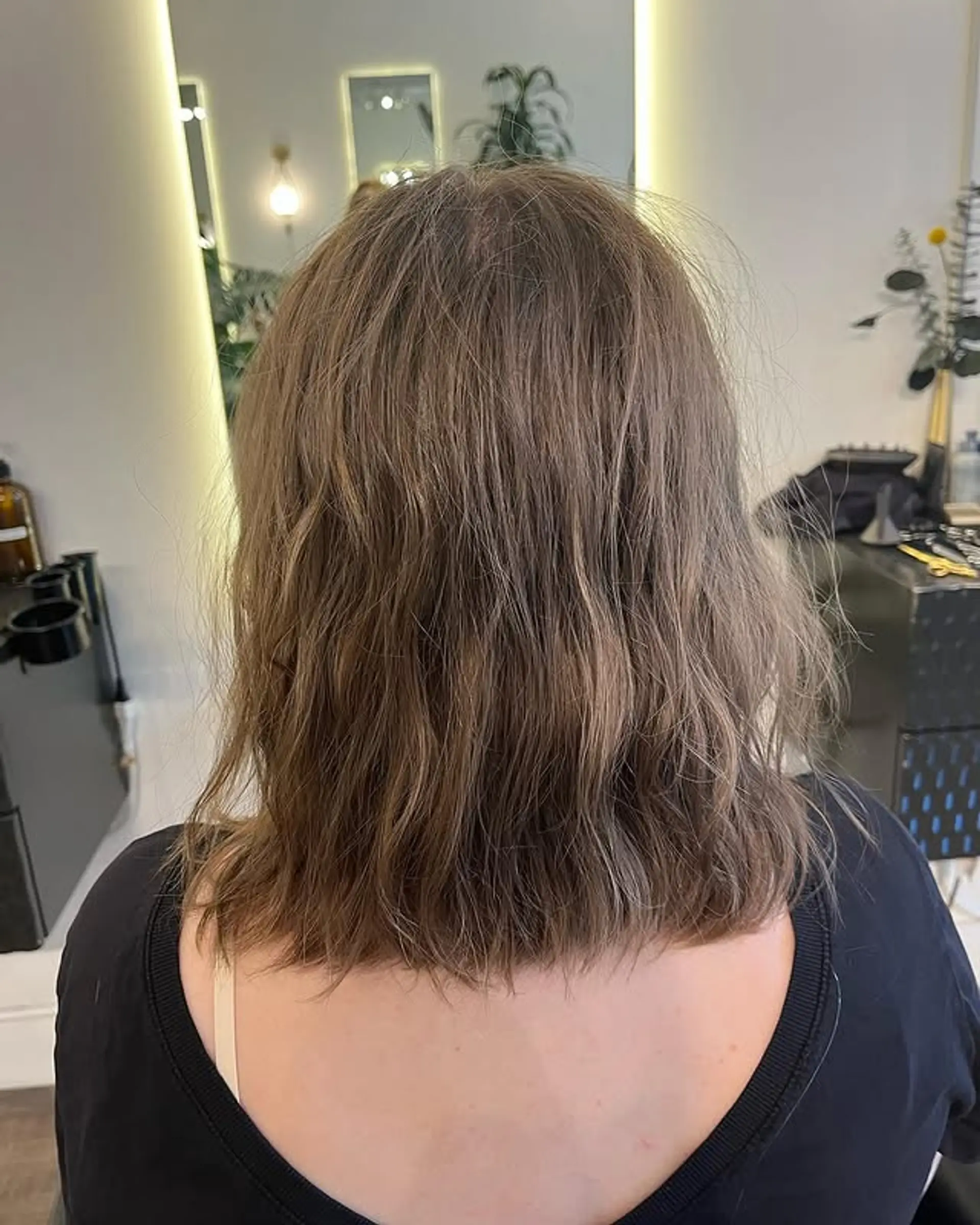 A textured medium-length lob (long bob) with soft waves and a layered cut. 1