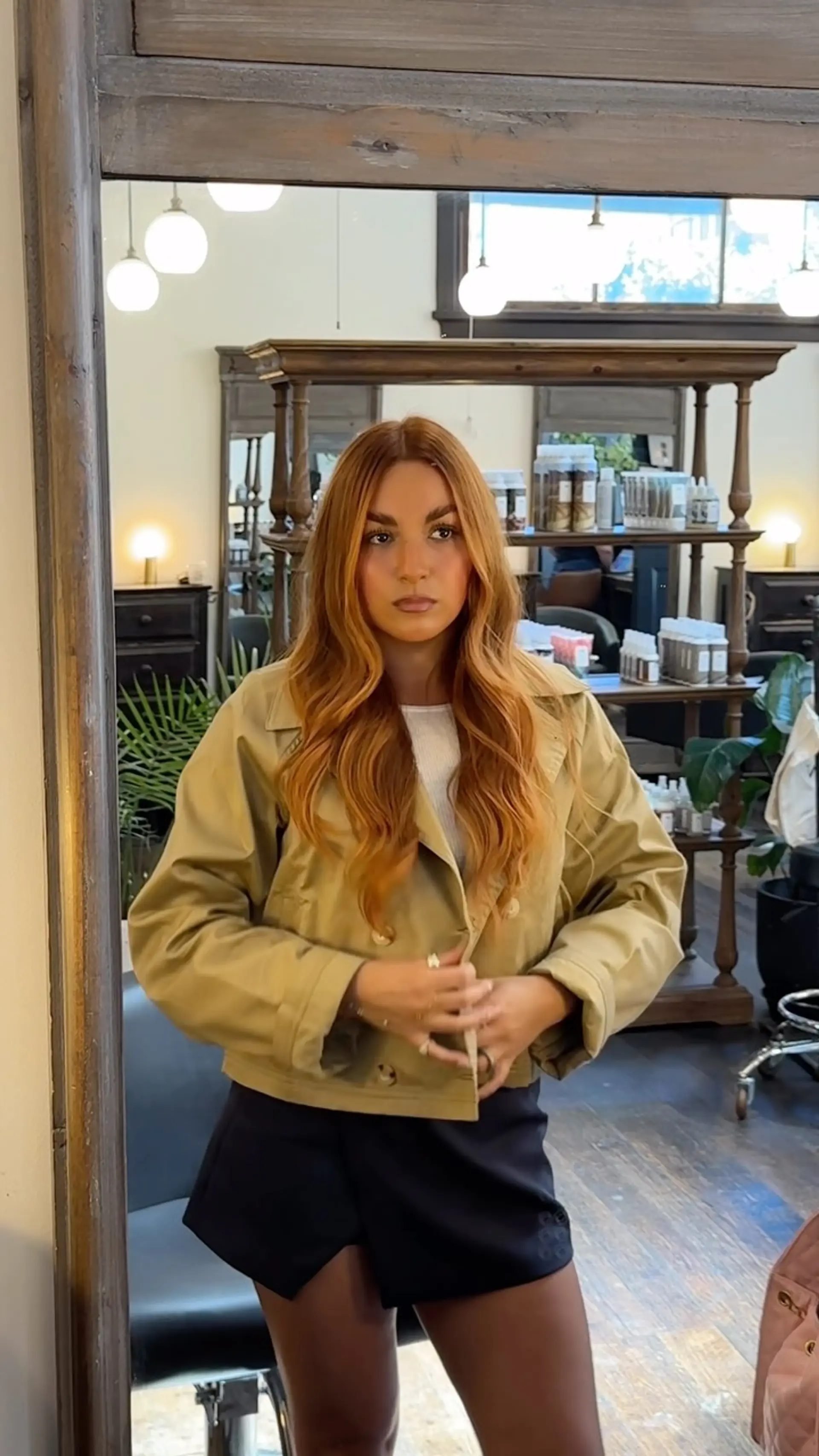 Long dimensional copper hair with warm highlights, parted in the middle and styled into loose waves. 1