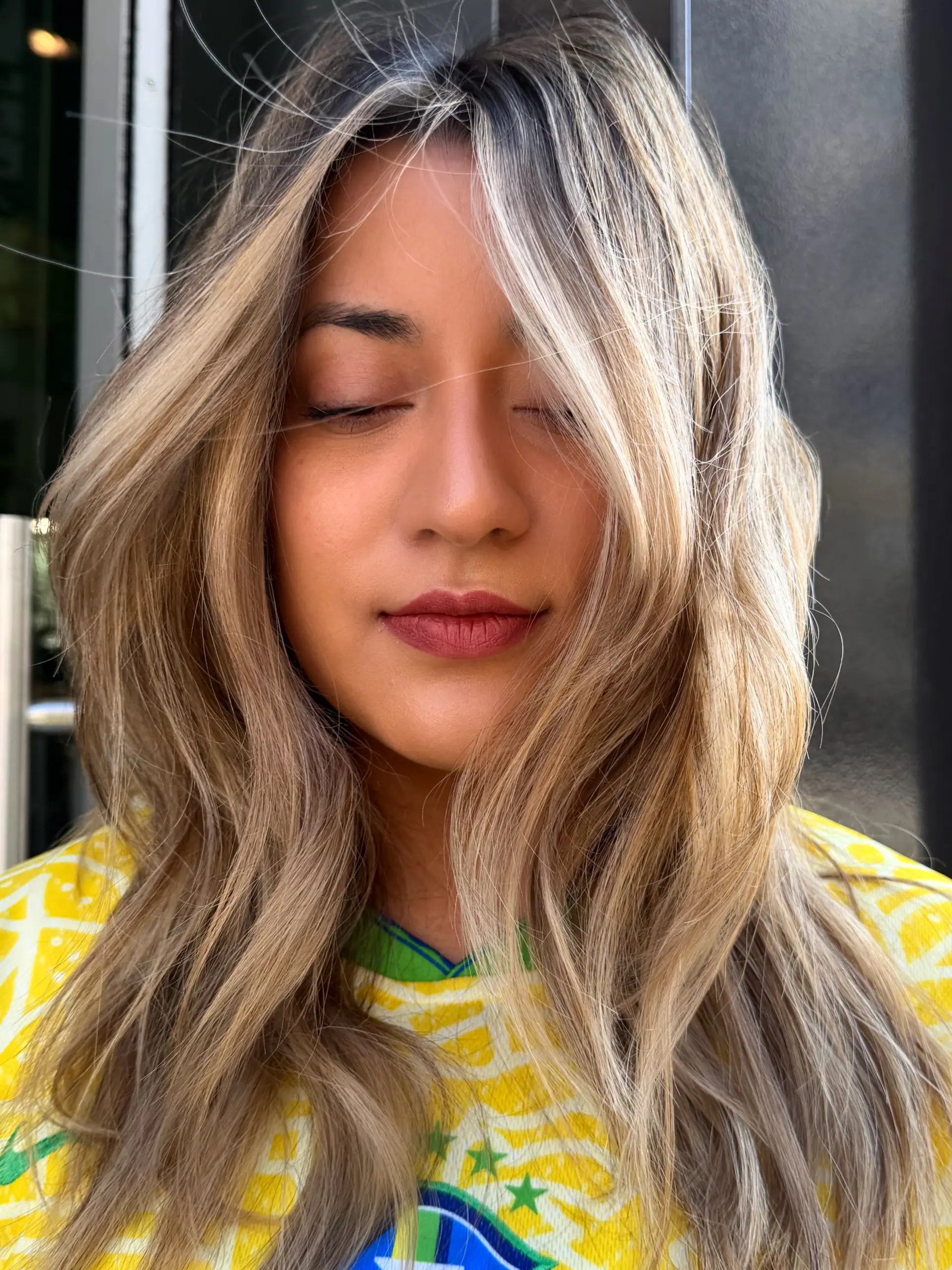 Long beige blonde balayage with face-framing layers and soft, dimensional waves. 1