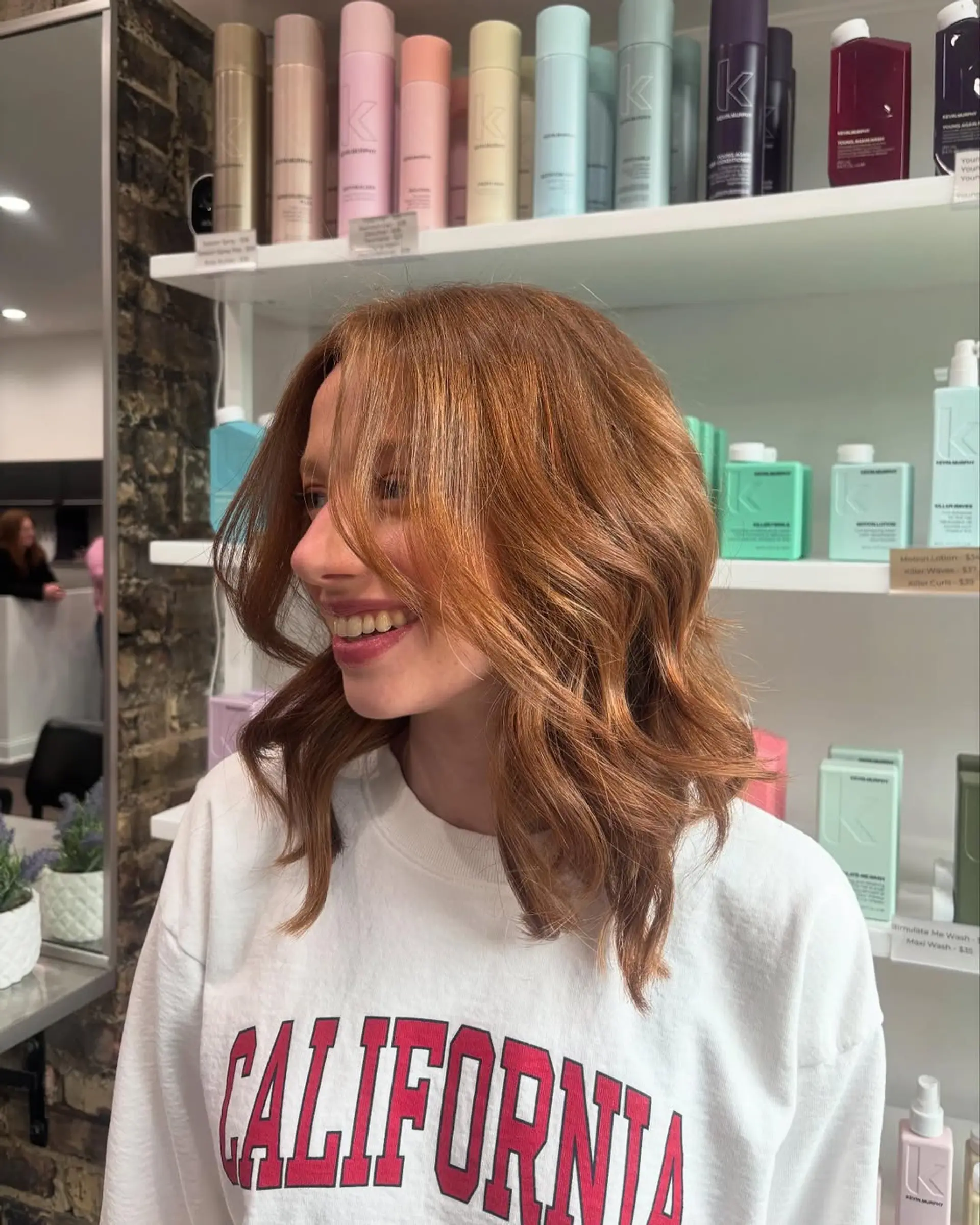 A medium-length wavy lob (long bob) with soft, voluminous layers, giving a modern and effortless look. 1