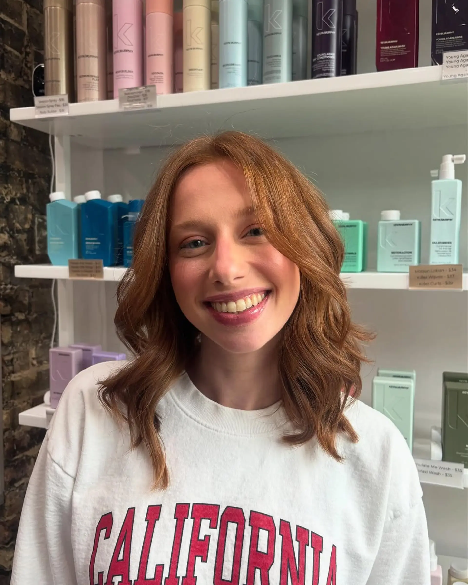A medium-length wavy lob (long bob) with soft, voluminous layers, giving a modern and effortless look. 2