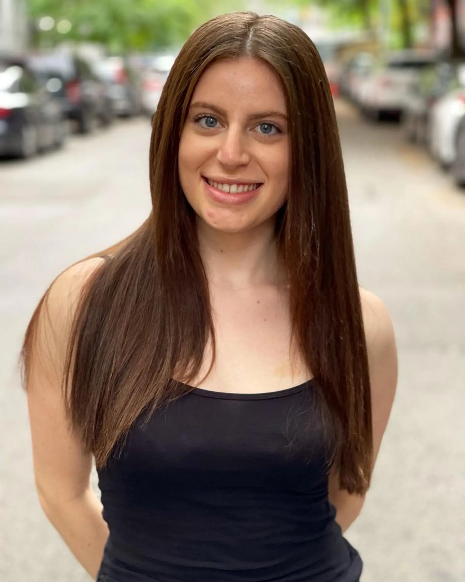 Long, sleek, straight hairstyle with a center part. 1