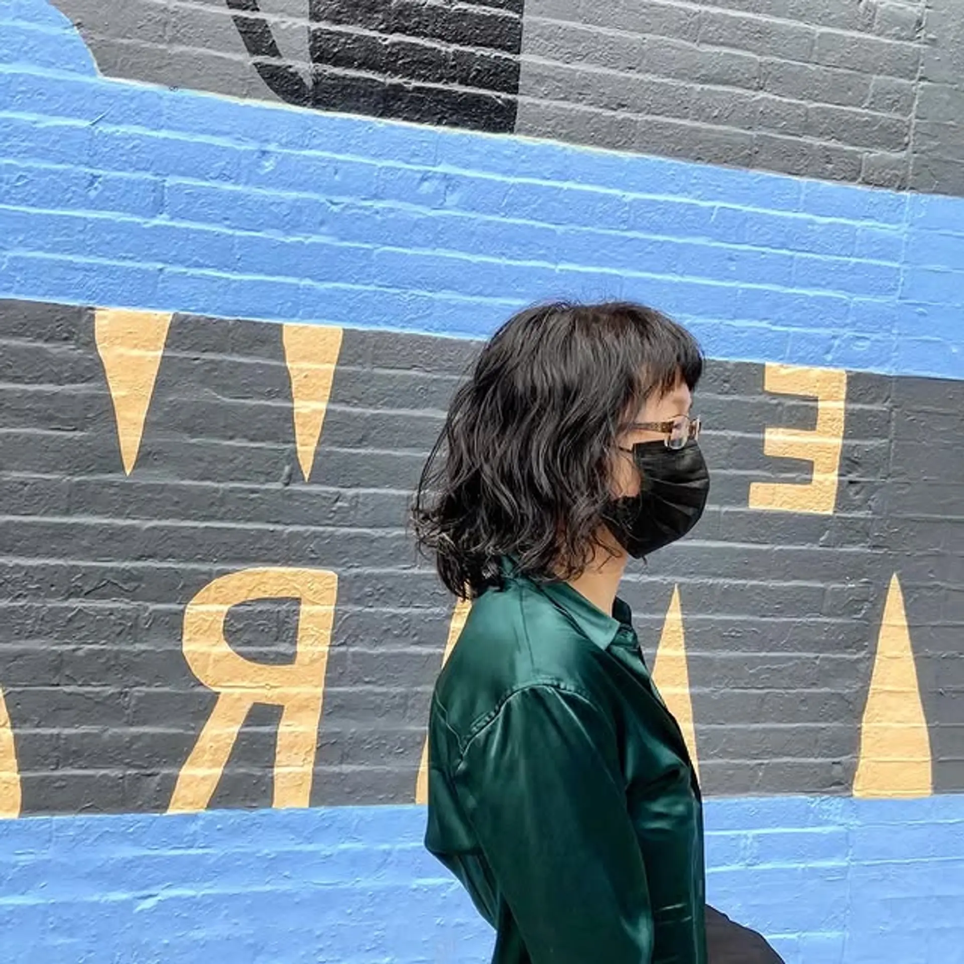 A chin-length wavy bob with bangs. 1