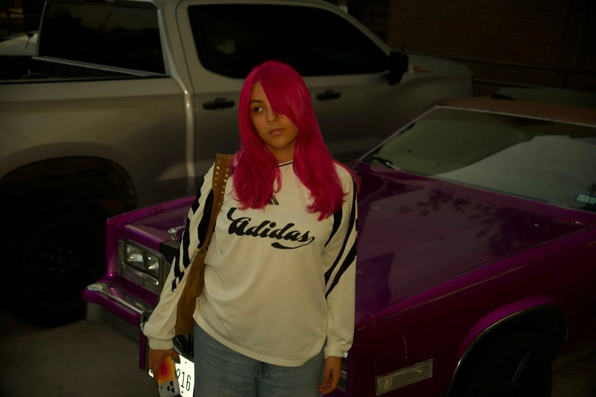Vibrant hot pink hair styled straight with side-swept bangs. 1