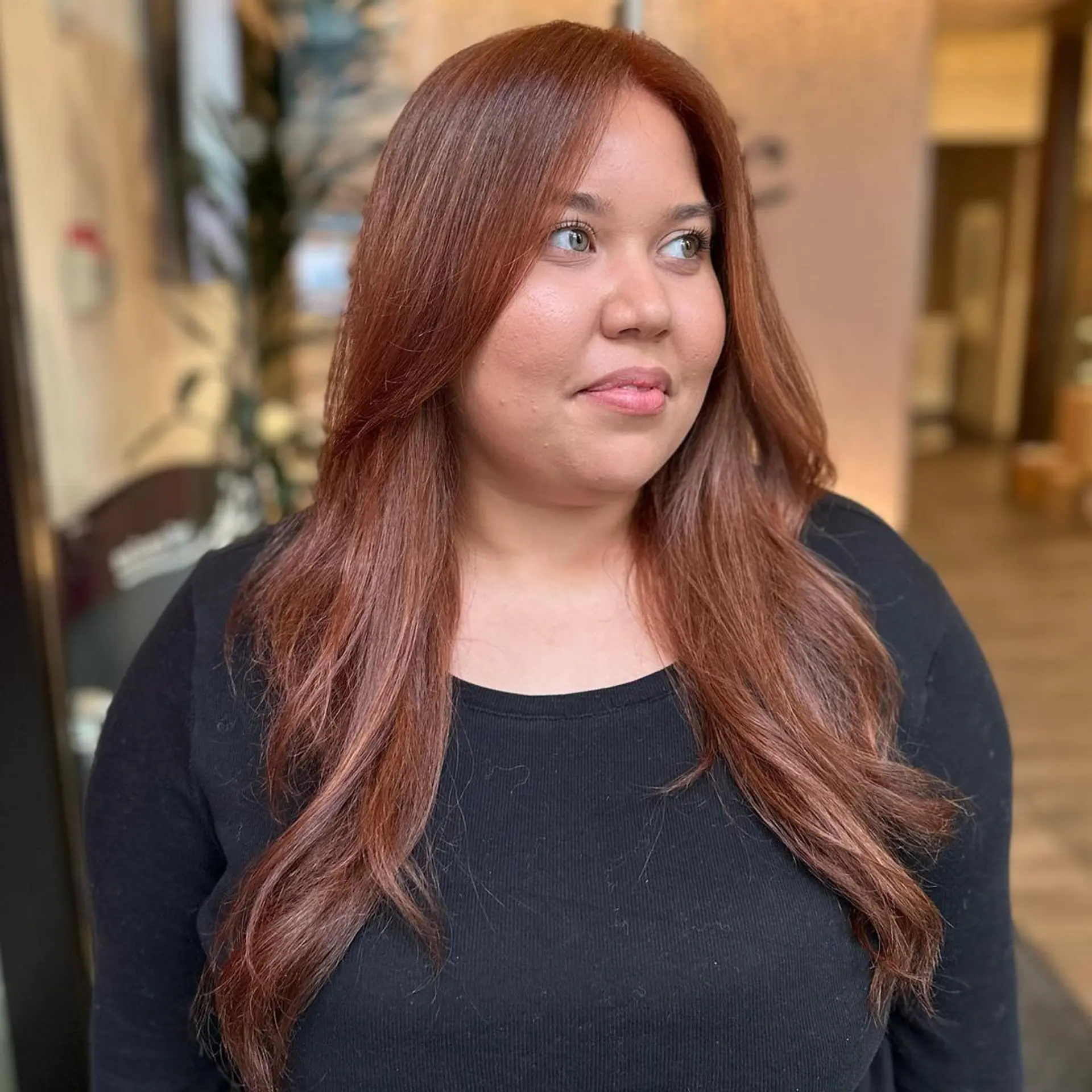 A long, wavy hairstyle featuring copper and chestnut tones, face-framing layers, and a smooth, shiny finish with a middle part.

Color by @simabeautynyc
 1