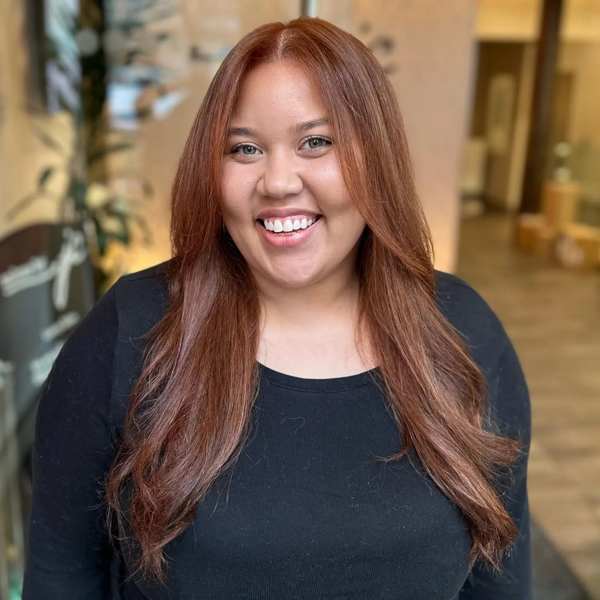 A long, wavy hairstyle featuring copper and chestnut tones, face-framing layers, and a smooth, shiny finish with a middle part.

Color by @simabeautynyc
 2