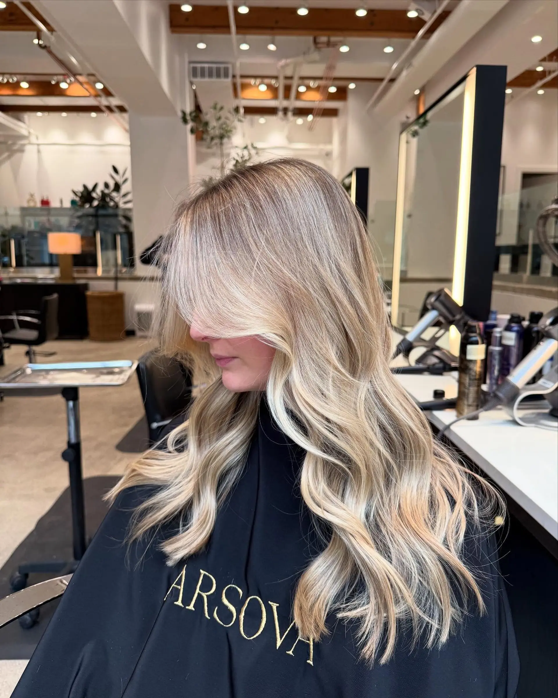 Long, wavy hair with long layers and curtain bangs. 1