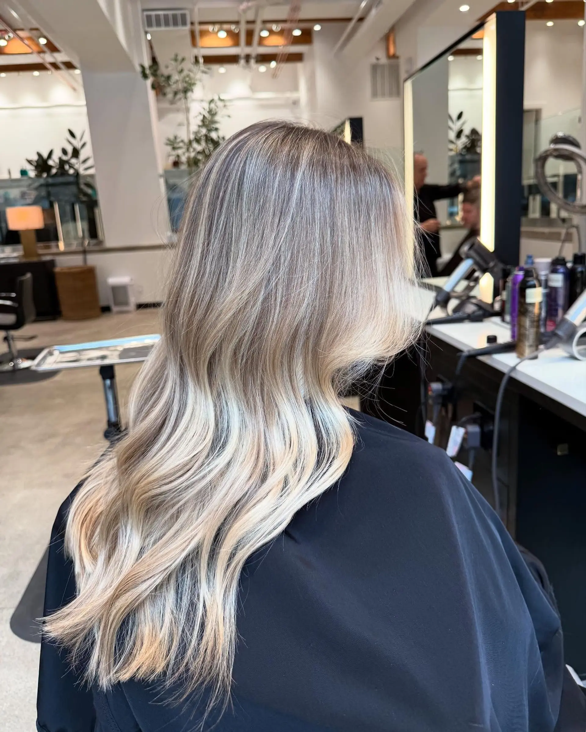 Long, wavy hair with long layers and curtain bangs. 2