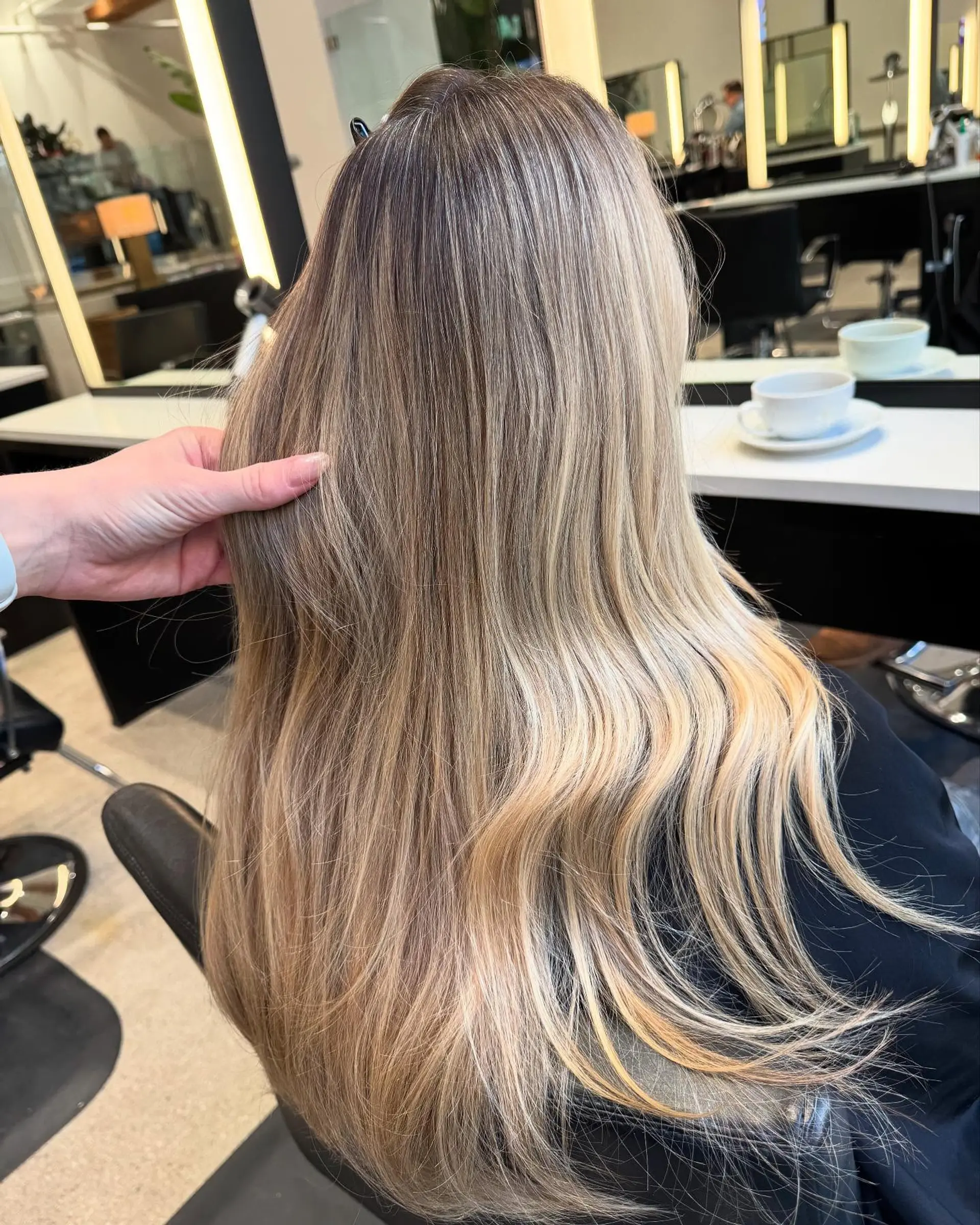 Long, wavy hair with long layers and curtain bangs. 3