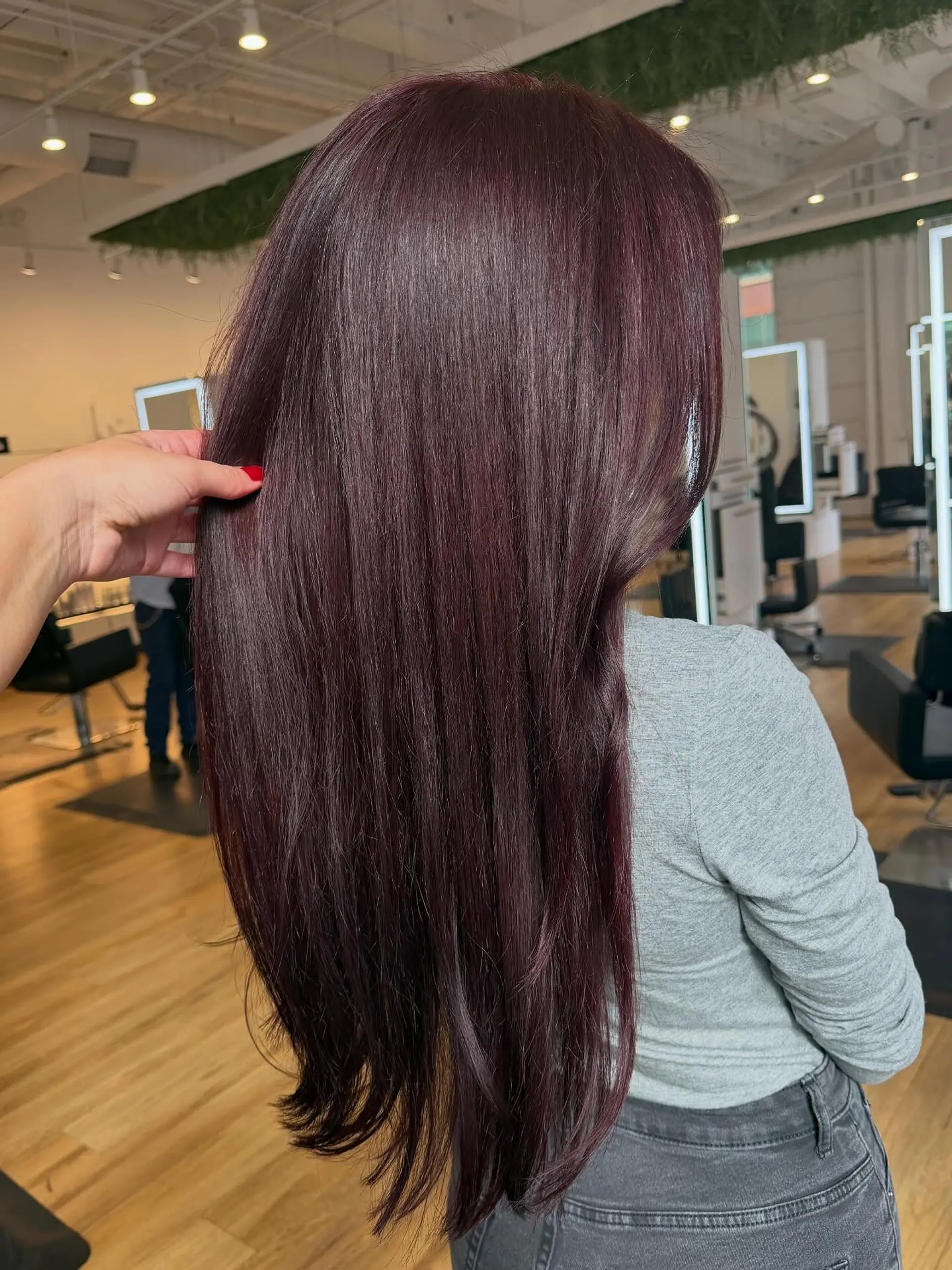 Long, smooth straight hair in a rich dark plum burgundy color. 1
