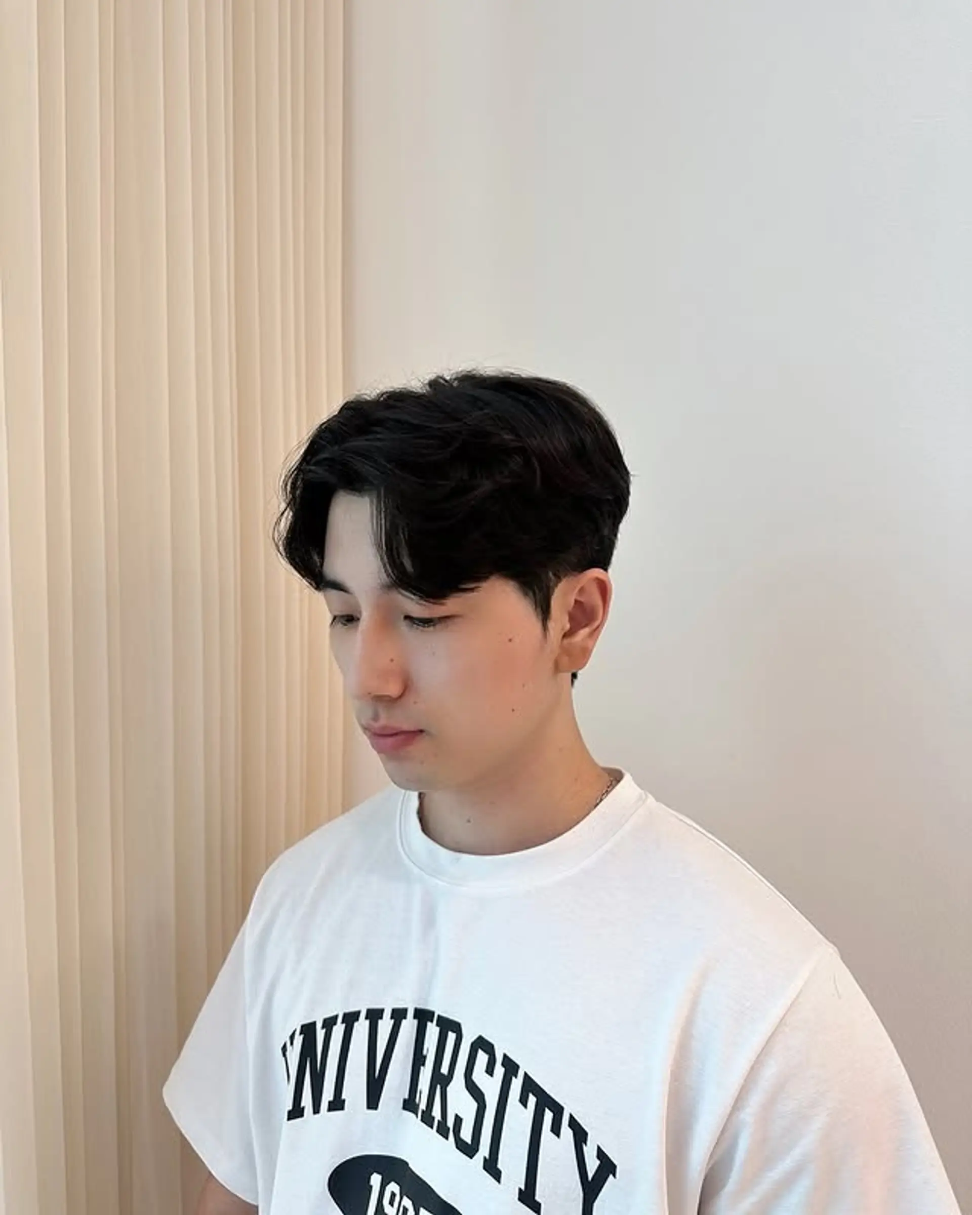 A modern short hairstyle featuring soft, natural-looking waves for a touch of texture and volume. 1