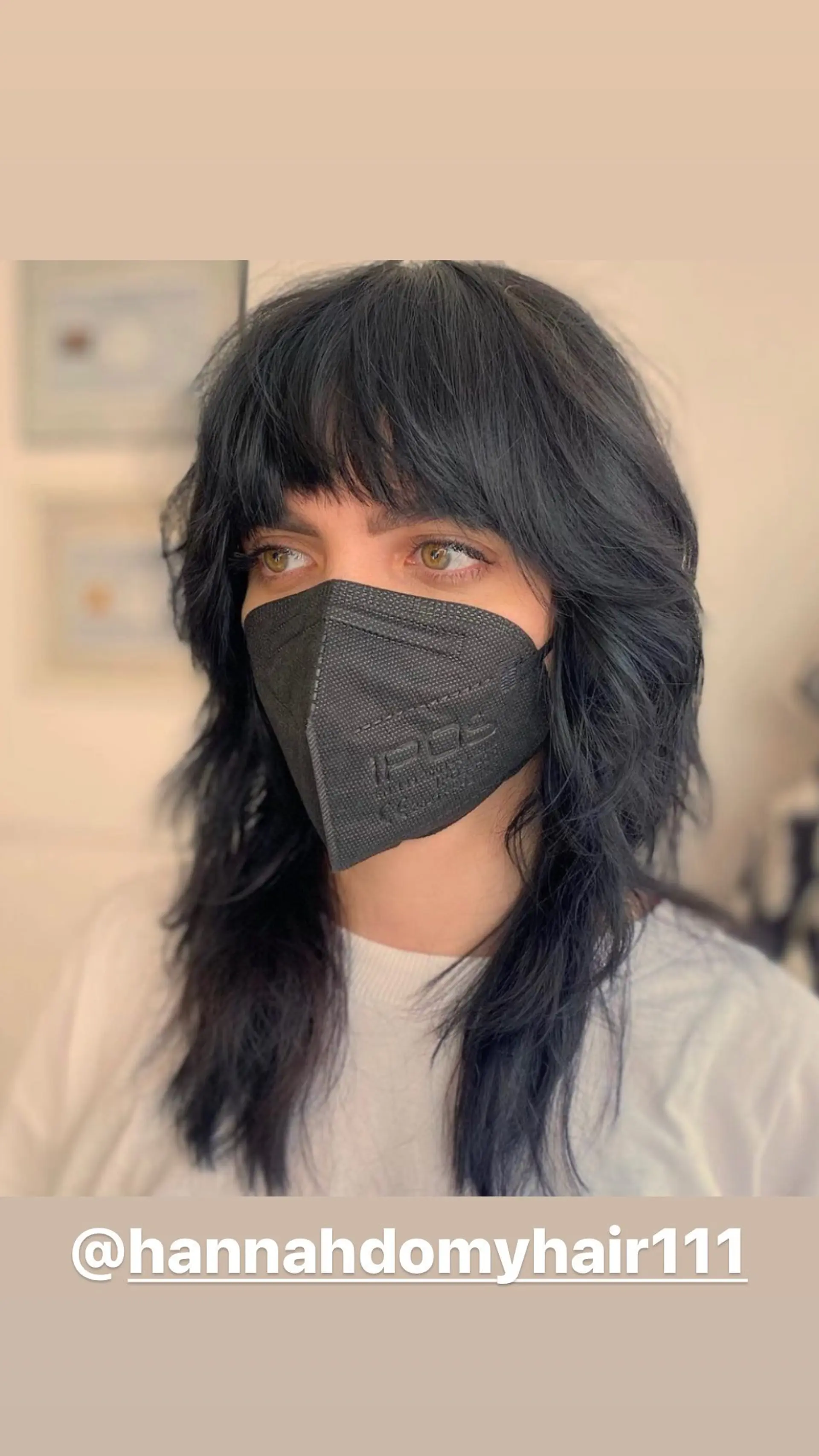 A stylish shag haircut with full bangs and layered texture. 1