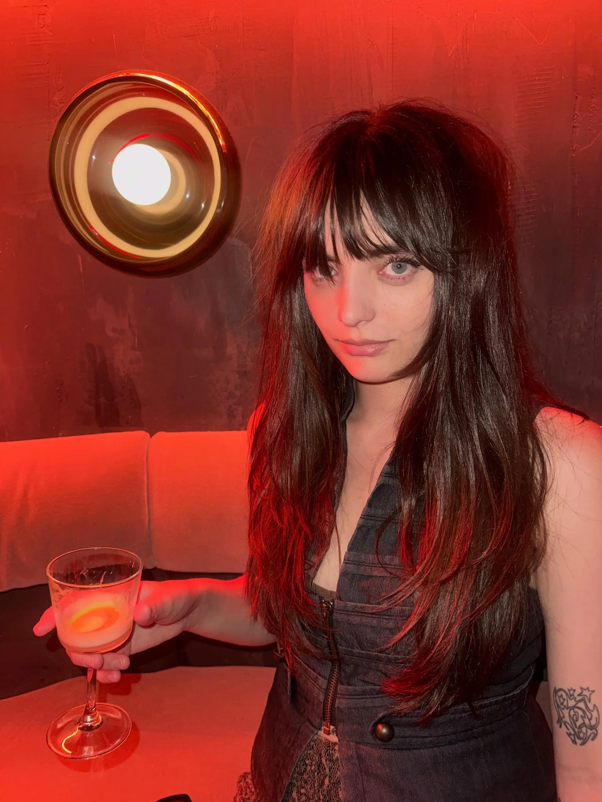 Long brunette layered shag haircut with piecey front bangs and textured face-framing layers. 1