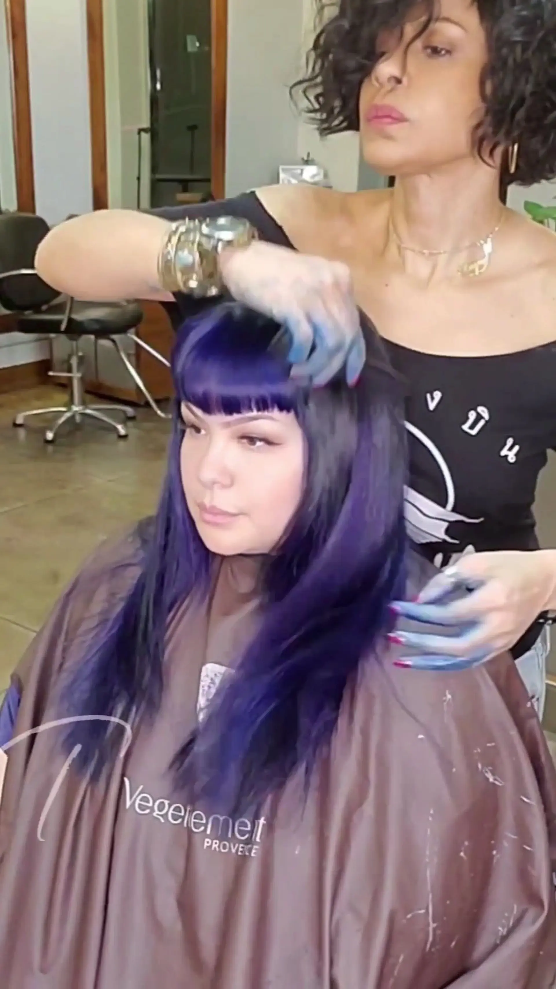 Medium-length straight vivid deep blue hair featuring classic Bettie Page style rockabilly bangs. 1
