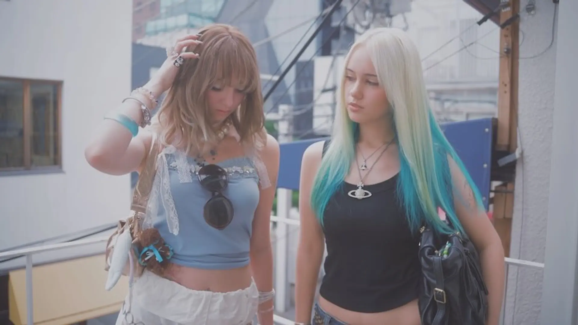Straight platinum blonde hair transitioning into vibrant turquoise dip-dyed ends alongside a layered light brown style with full bangs. 1