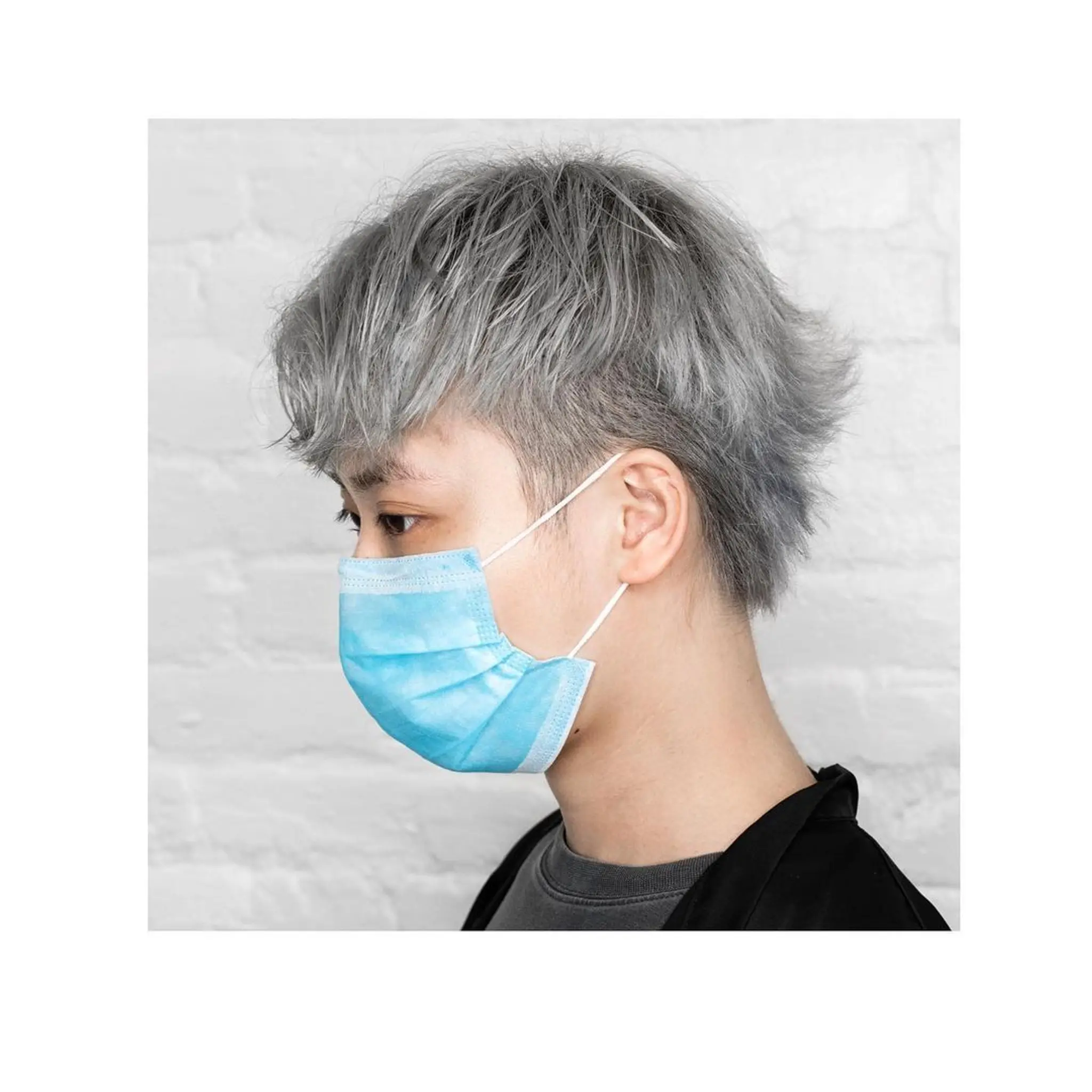 A short, straight, layered, and textured cut with an edgy vibe in a striking silver color.