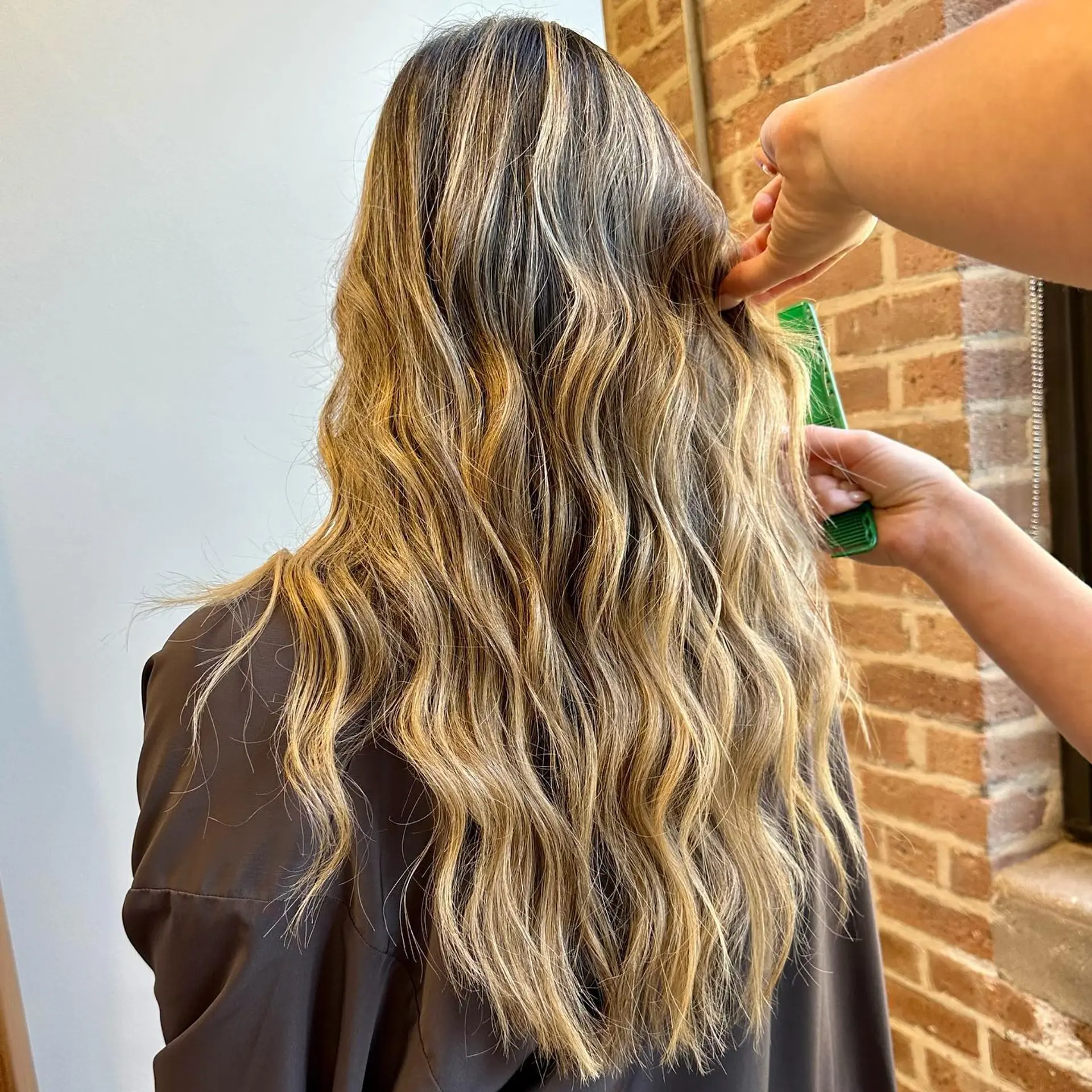 Long, wavy hair with a balayage color technique. 1