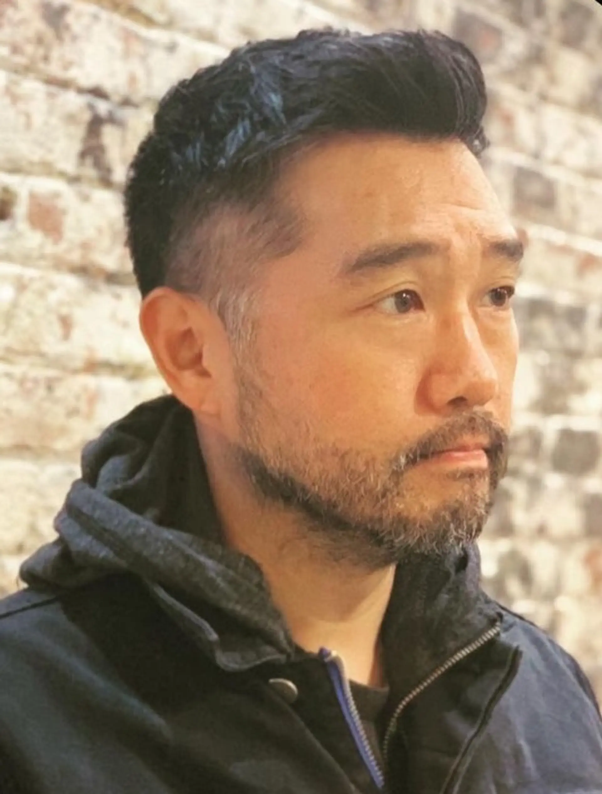 Short, straight hairstyle with a clean fade on the sides and back, textured top, and a subtle side part. Complemented by a well-groomed short beard, perfect for a professional look. 1