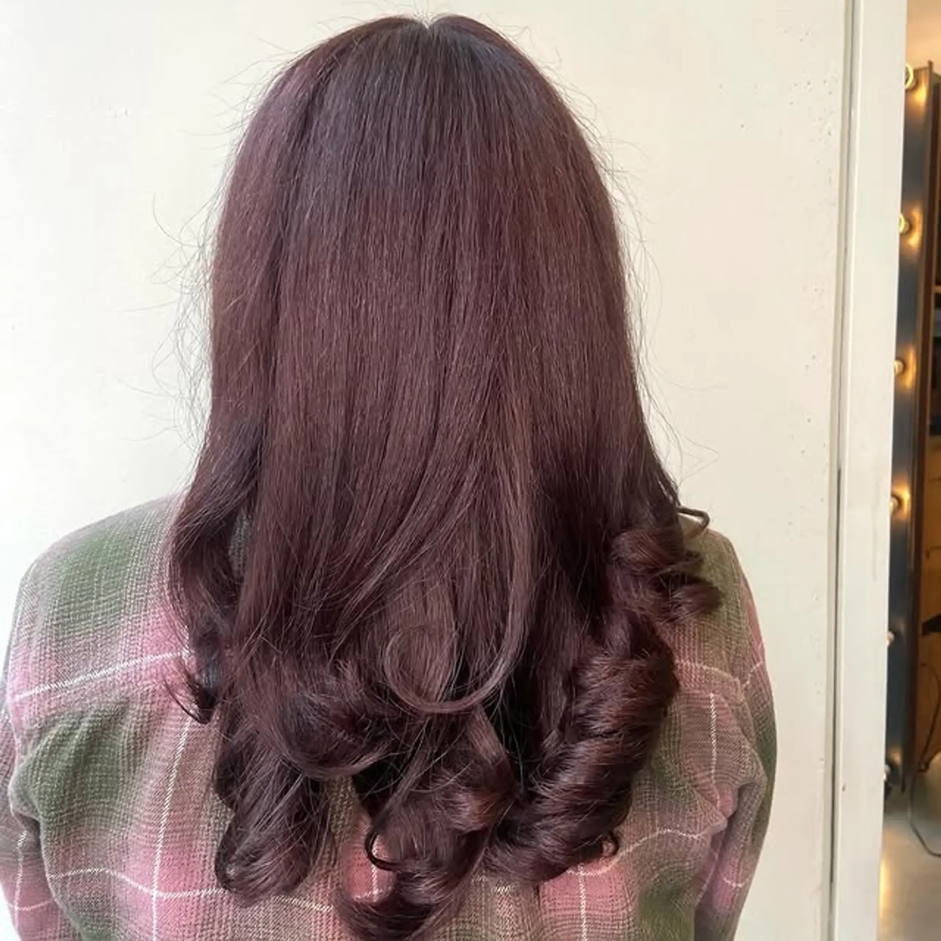 A long, layered haircut with romantic curls. 1