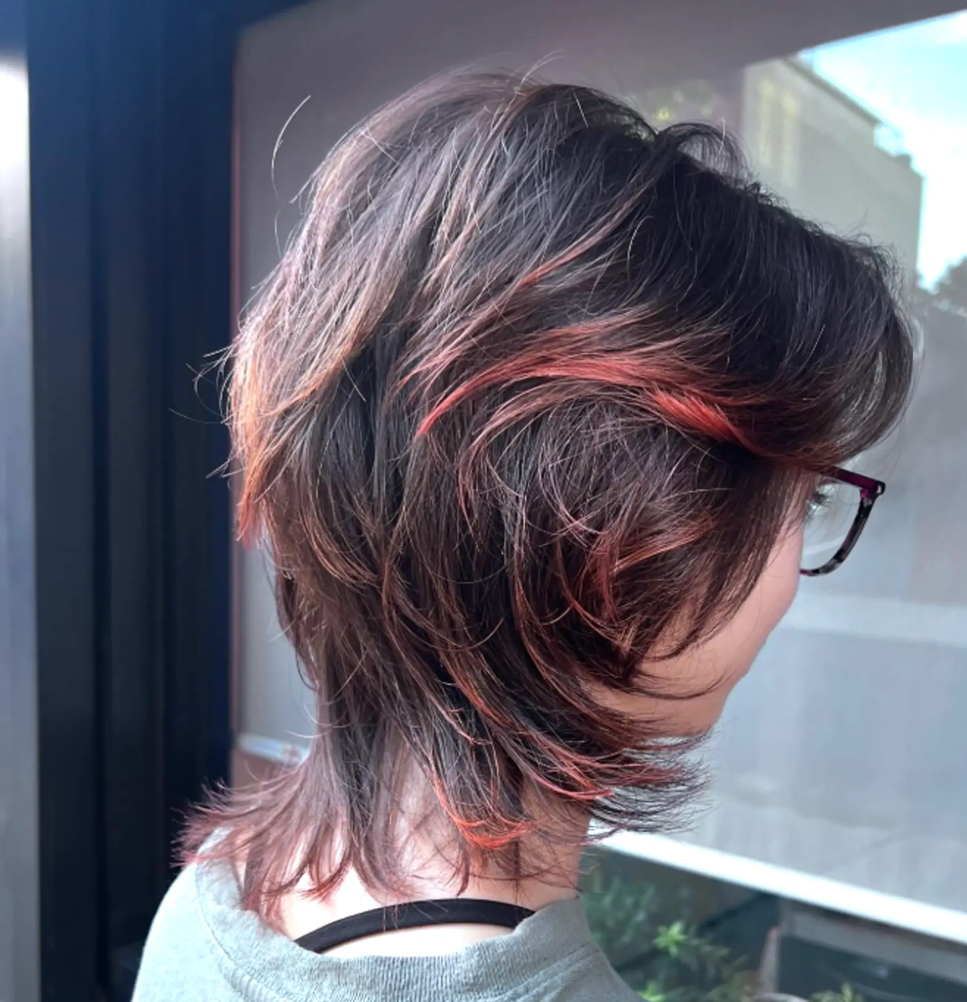 A layered shag haircut with copper highlights. 1