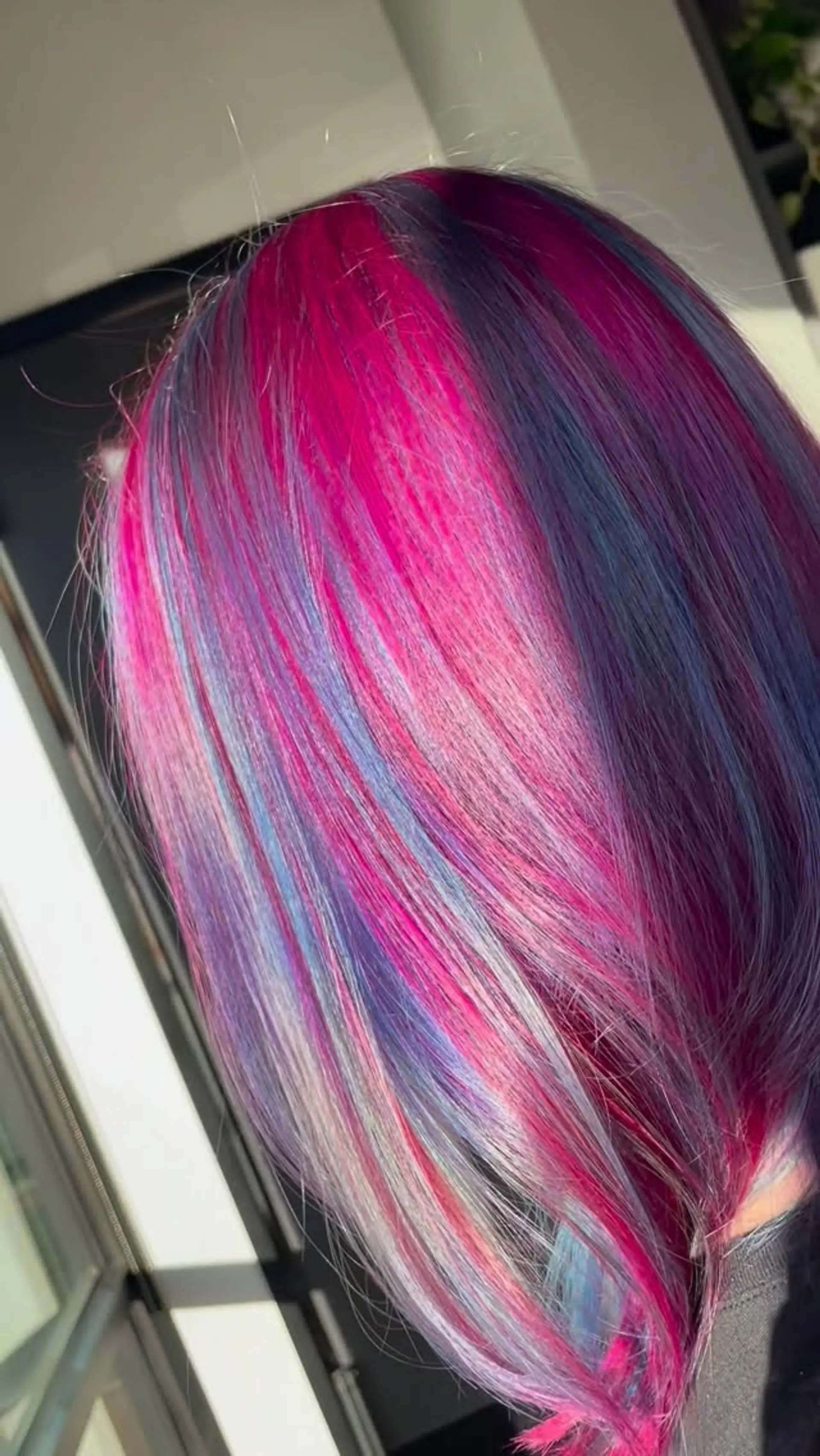 Straight hair featuring a multi-dimensional blend of bright magenta, purple, blue, and pastel pink hues. 1