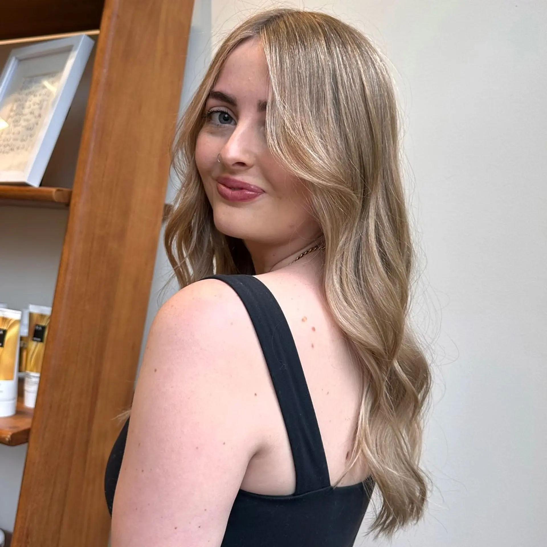 Long, wavy hair with blonde balayage and face-framing layers. 1