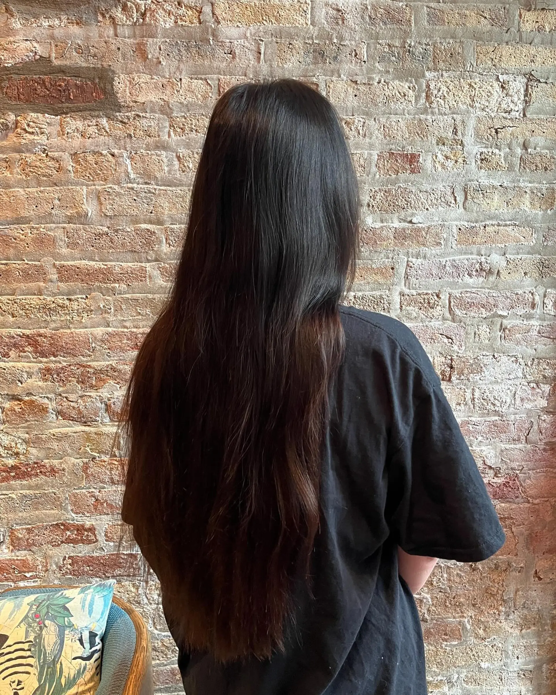 A long, straight hairstyle with subtle layers for added movement and shape. 1