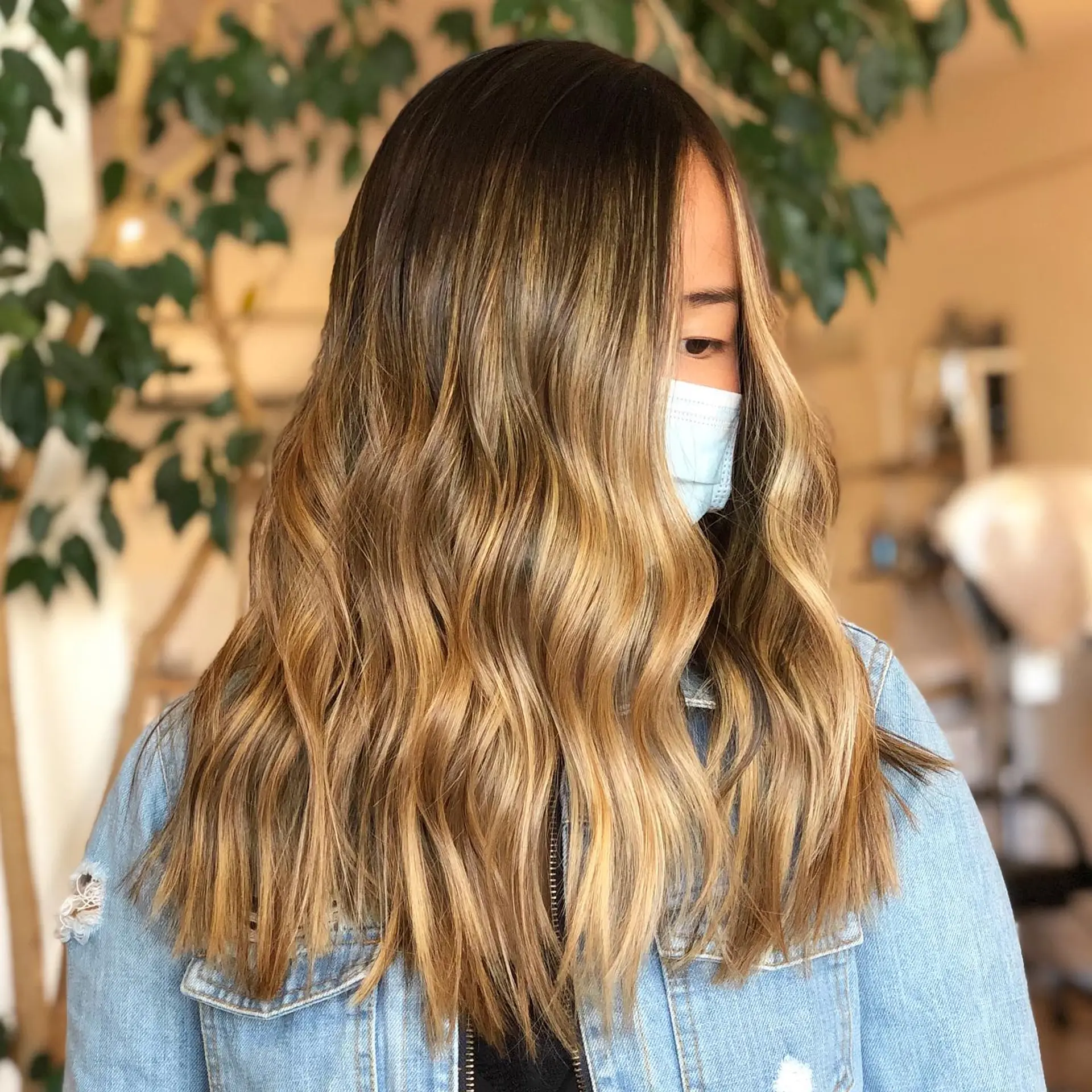 Long dimensional waves featuring a soft honey and golden blonde balayage with a shadowed dark base. 1