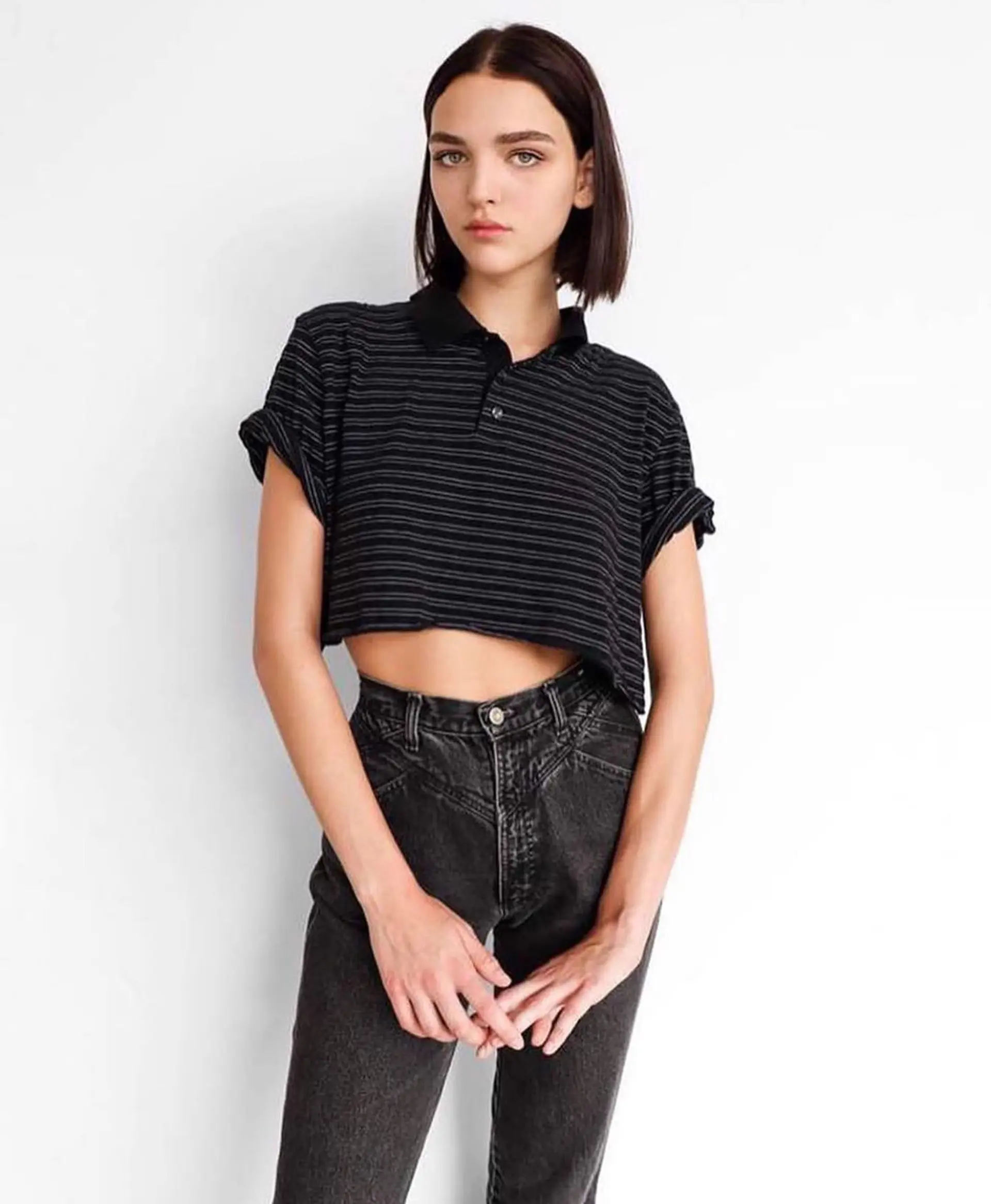 A sleek, chin-length blunt bob styled straight with a center part. 1