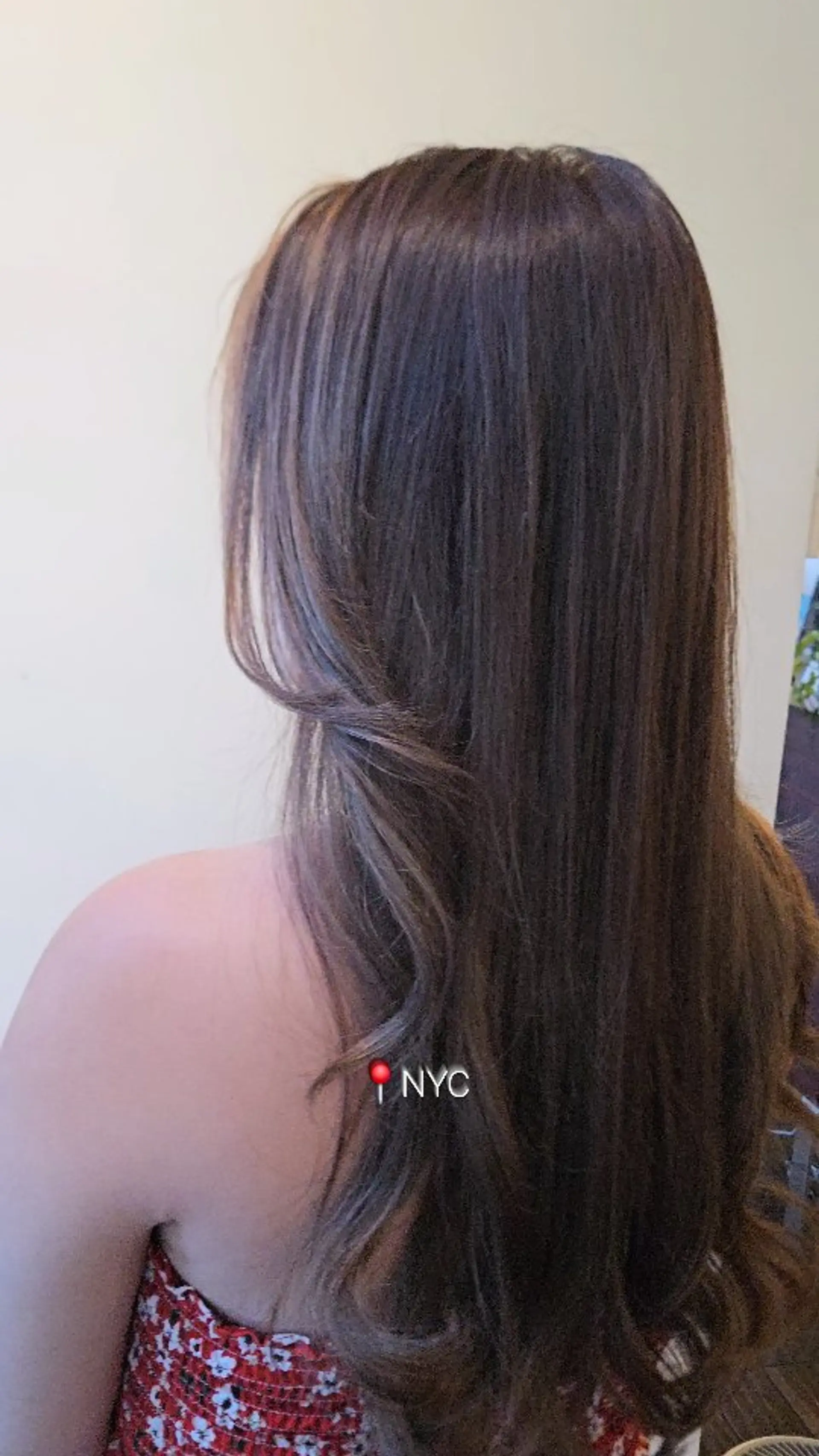 Long dimensional brunette hair styled with soft, cascading waves and subtle highlights. 1