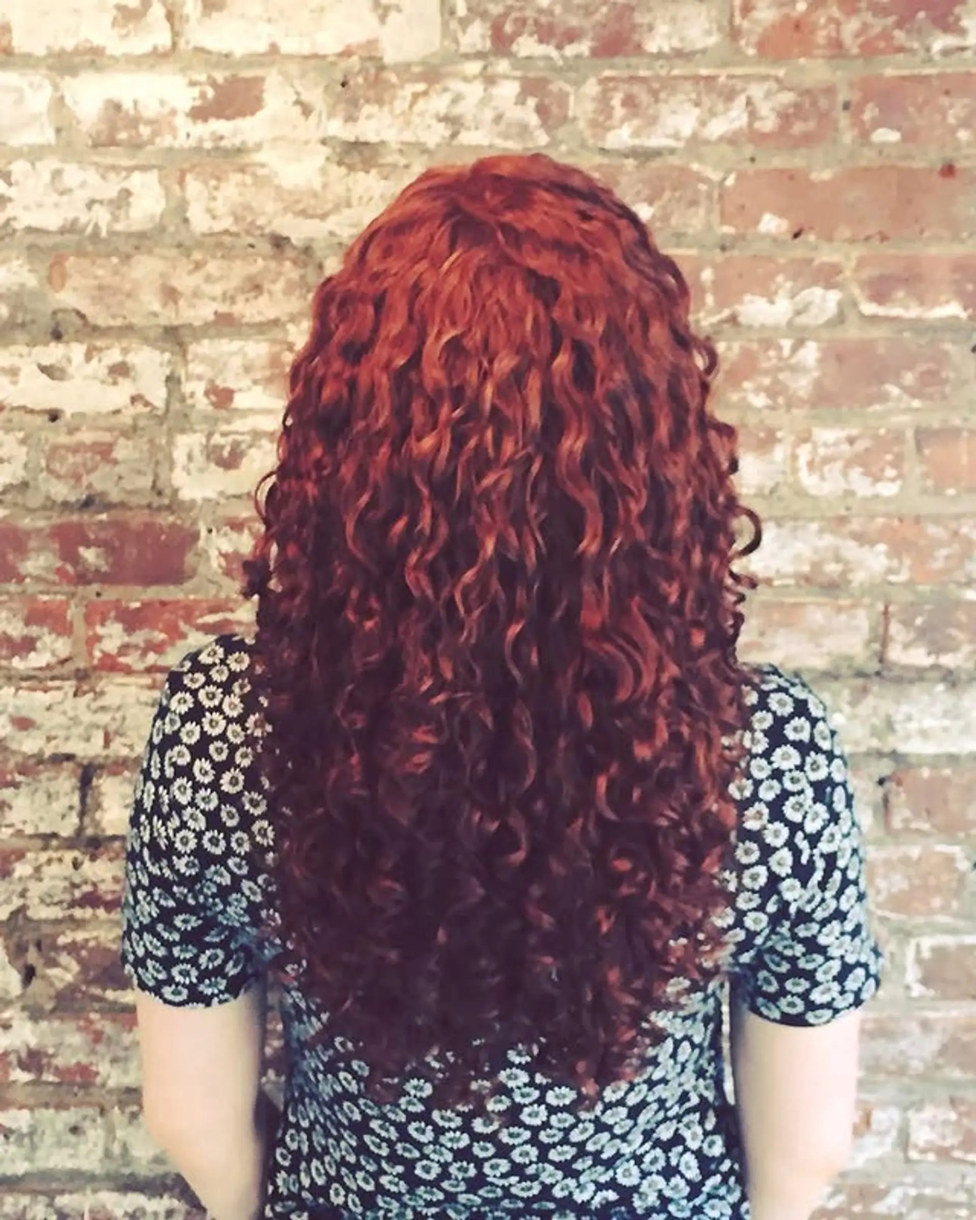 Long, defined Botticelli curls with layers for volume and shape. 1