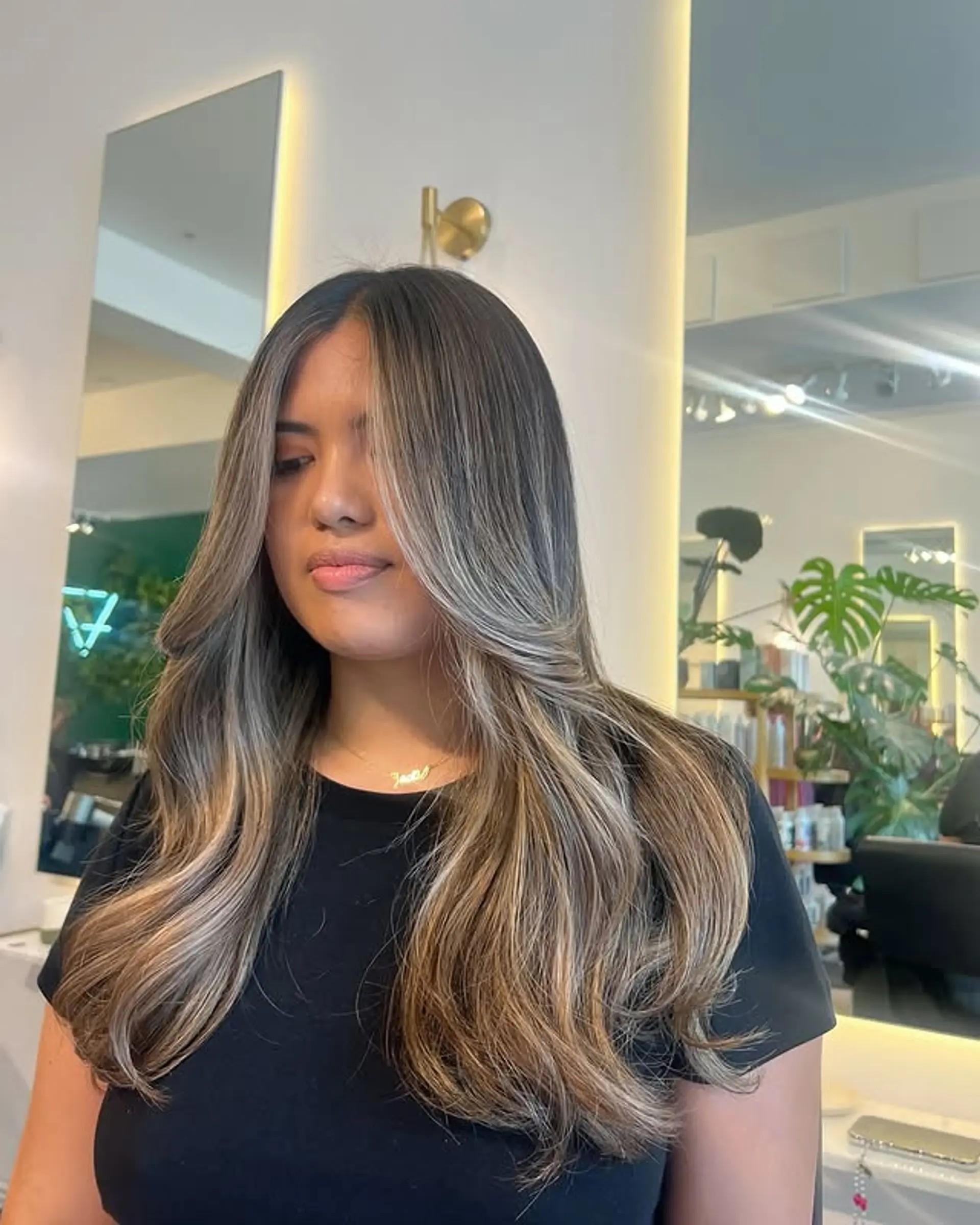 Long hair with soft, face-framing layers and a bronde balayage. 1