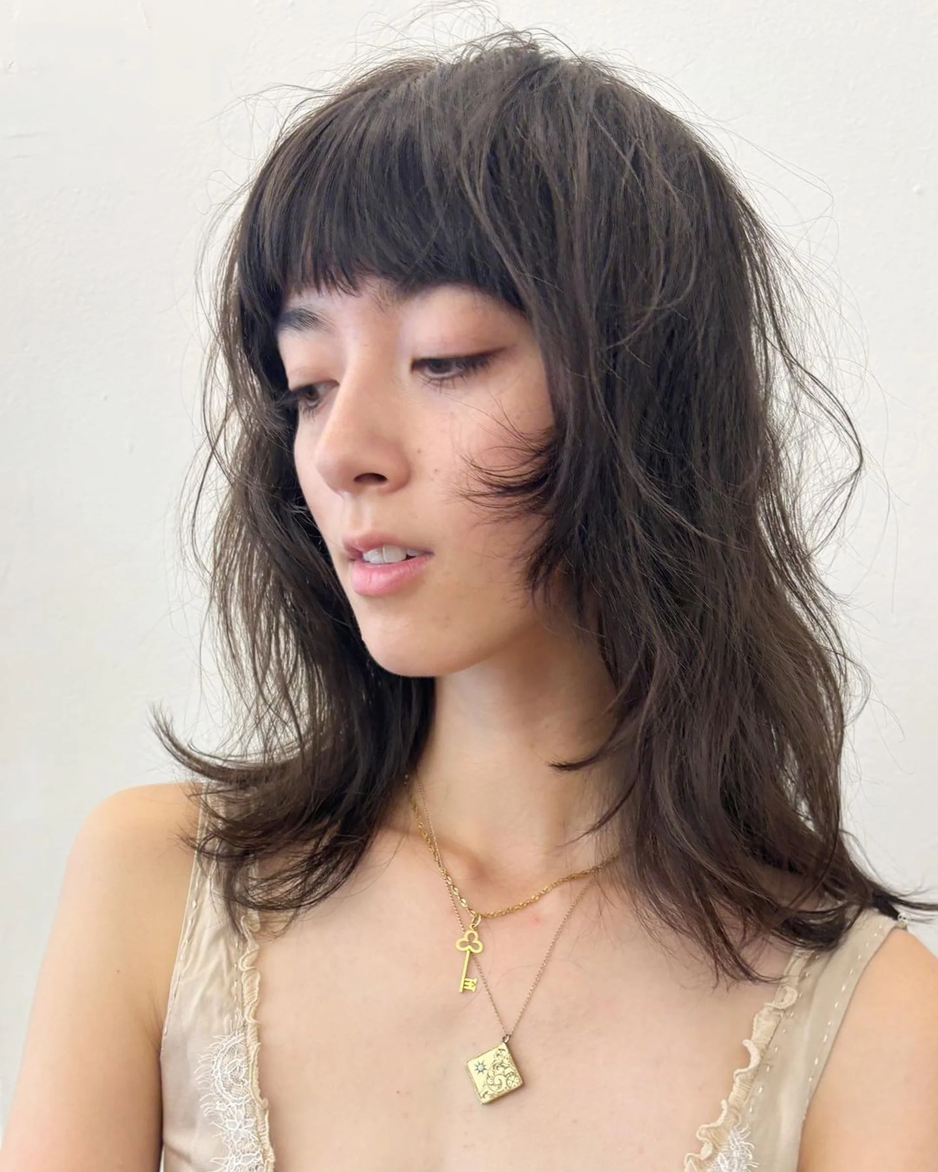 A woman with long, straight hair showcasing a vibrant pink and magenta balayage, a key look in the Los Angeles 2026 hair trend forecast. - Preview 3